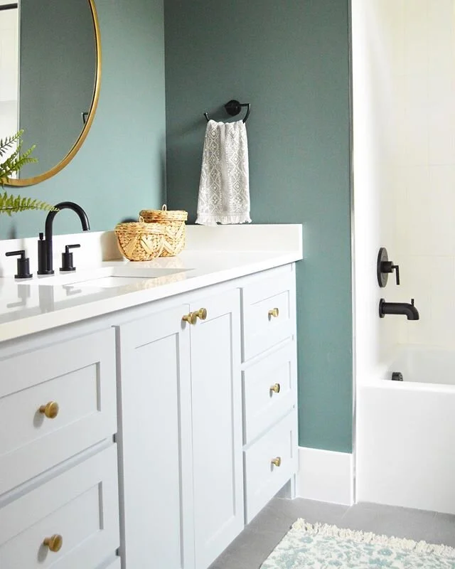 I am often asked what&rsquo;s the latest trend in interior design and the answer is....mixed finishes! In this bath we used matte black plumbing with a gold mirror and cabinet hardware. #tammytrylkointeriors #interiordesign #dallasinteriordesign