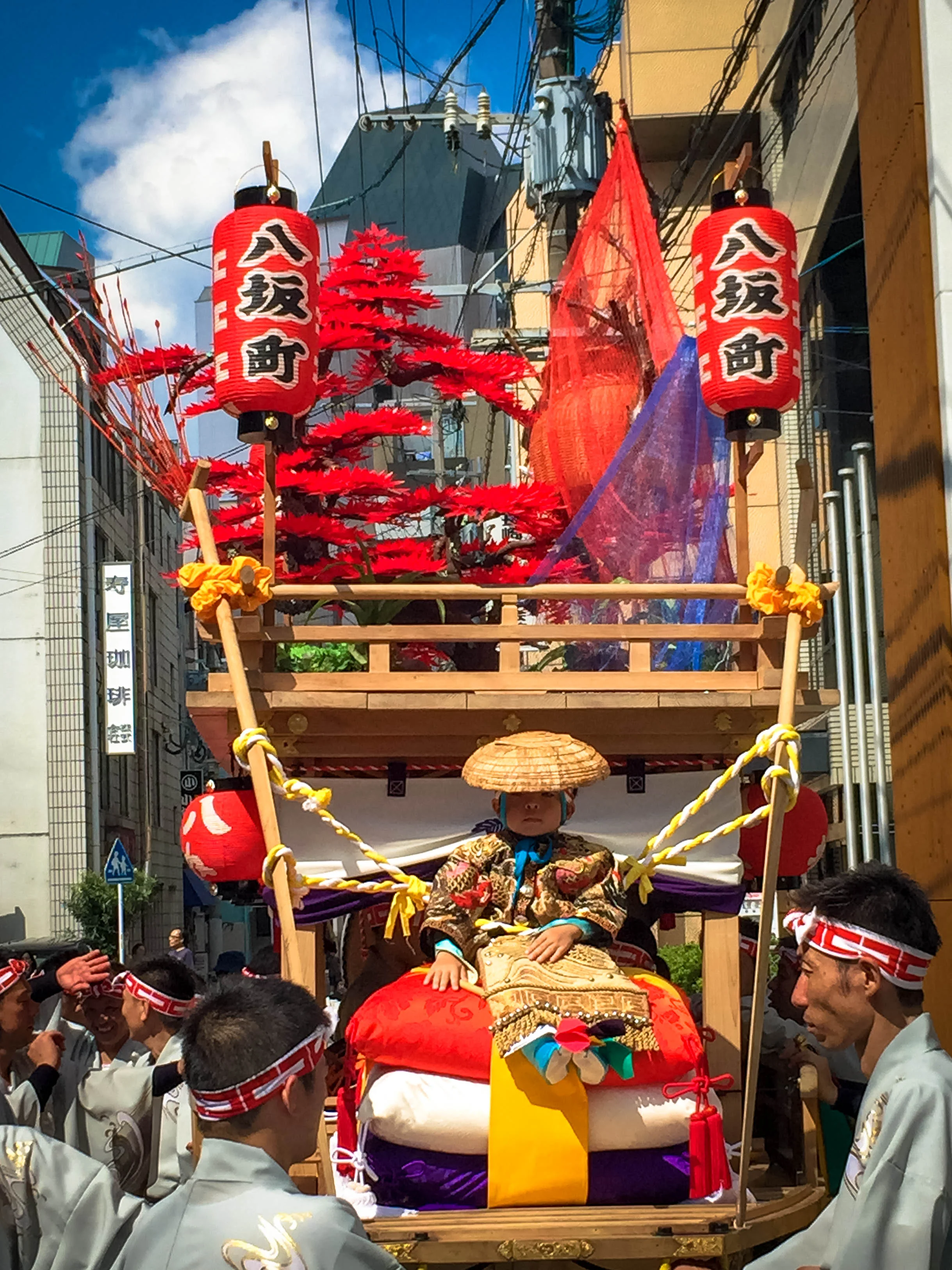 The best part was this one child being carried aloft a float sitting on no less than three massive pillows like the true supreme ruler he is on the inside. 