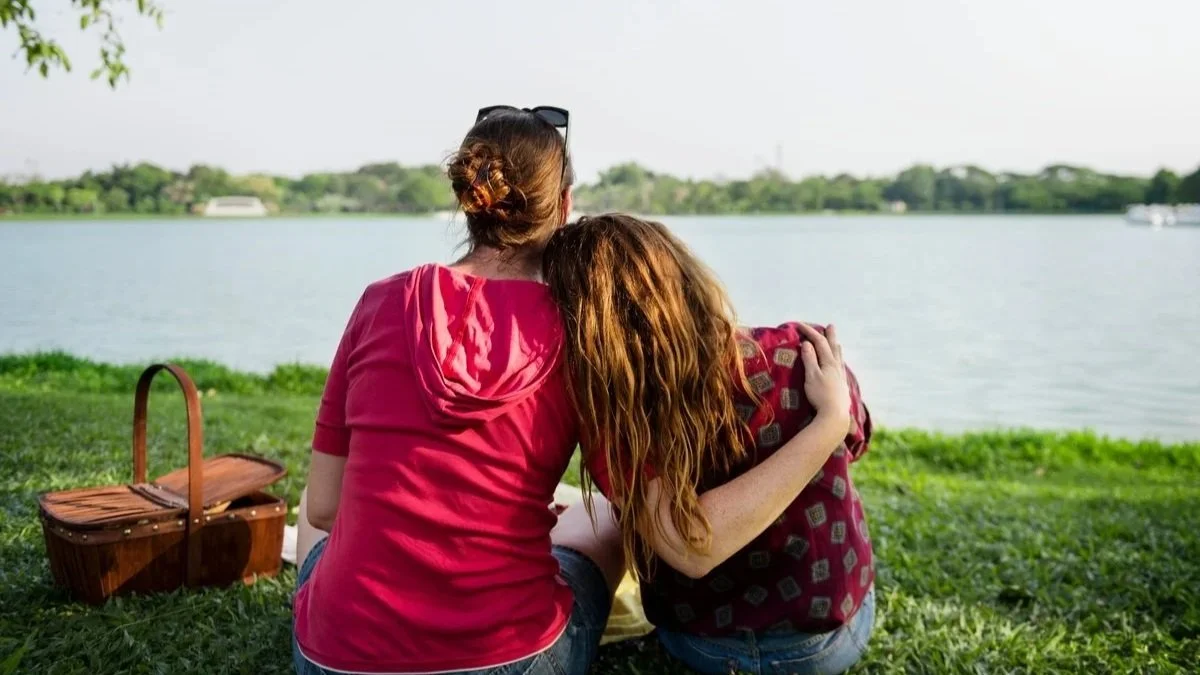 mother and daughter sitting together by lake Connecticut teen therapy outcome