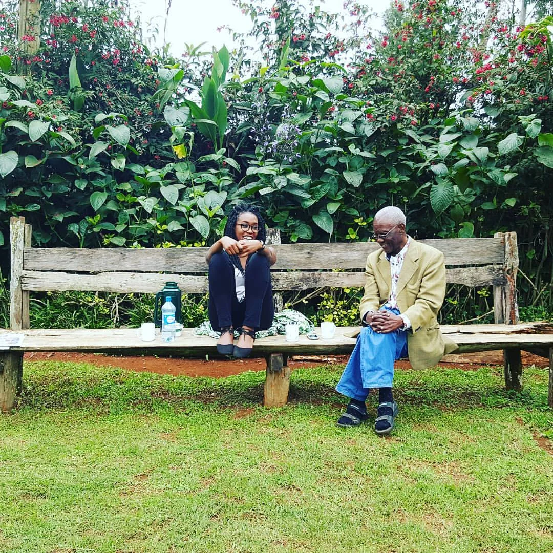My father and I outside his home in Ndakaini