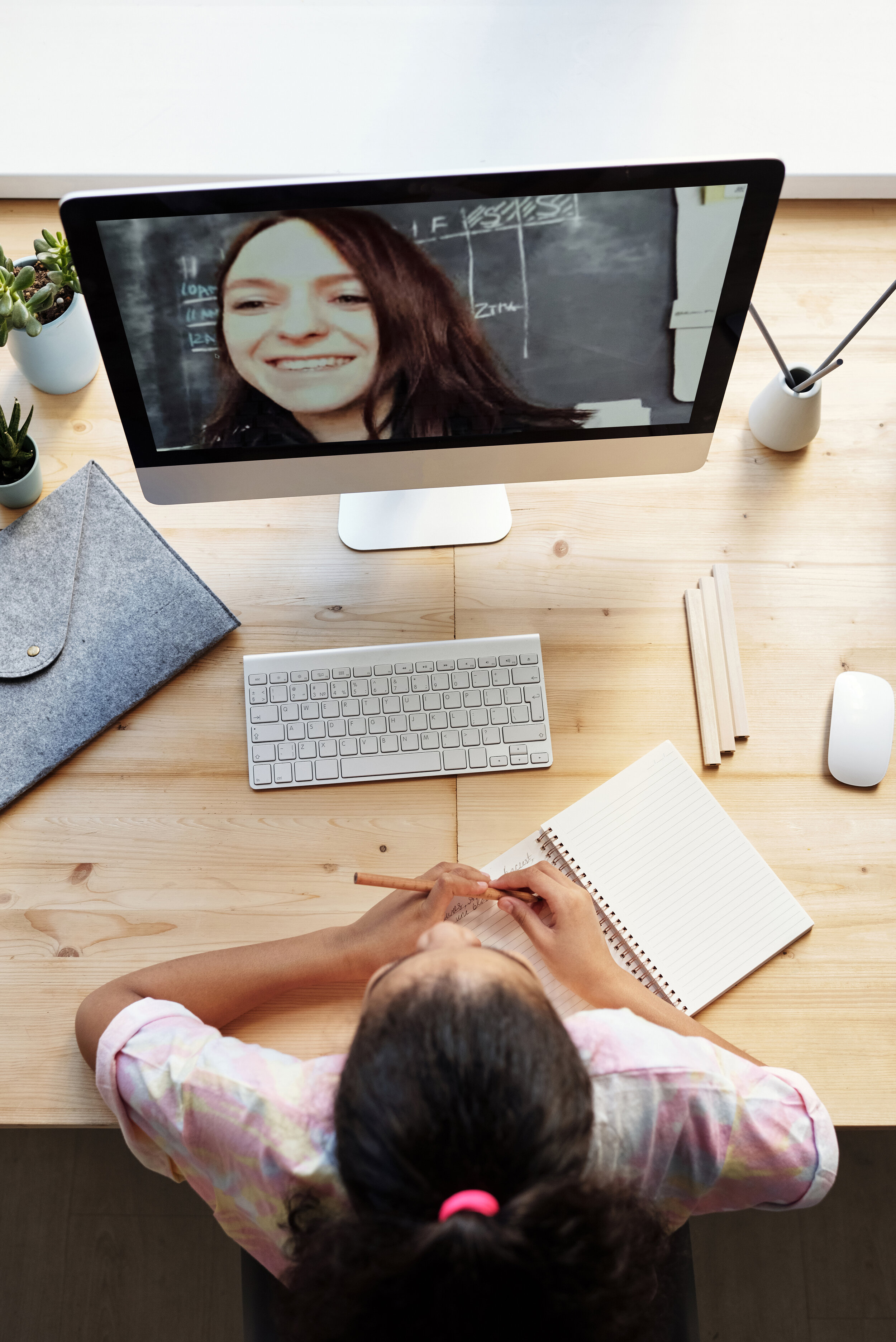 top-view-photo-of-girl-watching-through-imac-4143792.jpg