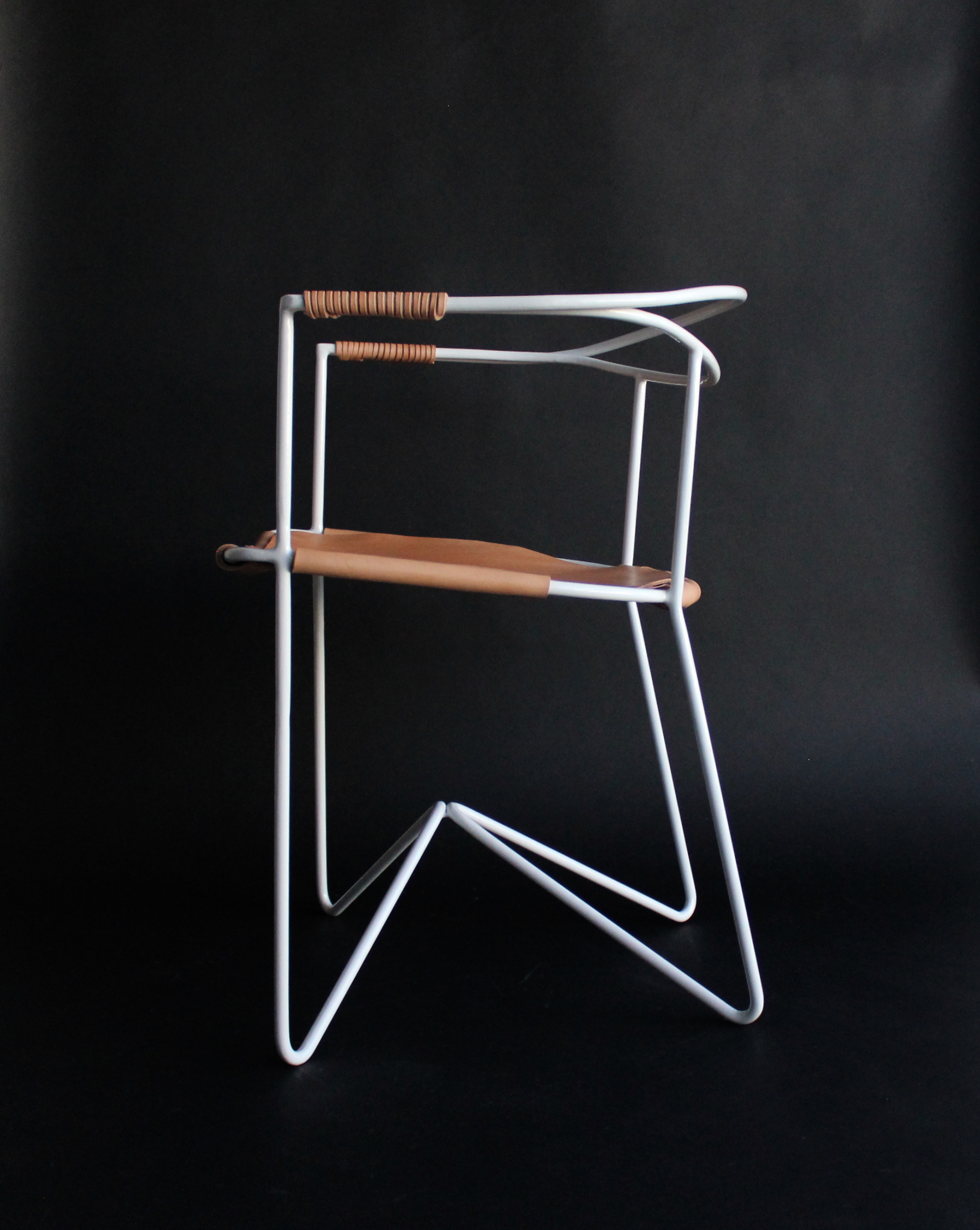 Leather available in natural or black. Frame available in white or black powdercoat.