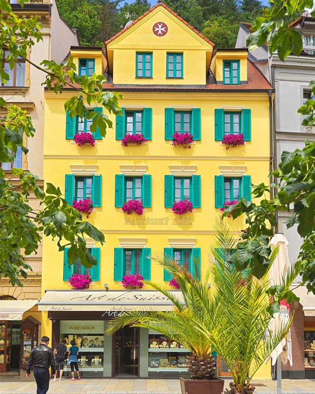 This is about as Czechia 🇨🇿 building front as you could ever possibly find. 
I had this dreamy notion that the spa towns of Czechia would have building painted like ice cream flavors, with colorful flowers hanging off the windowsills packed neatly 