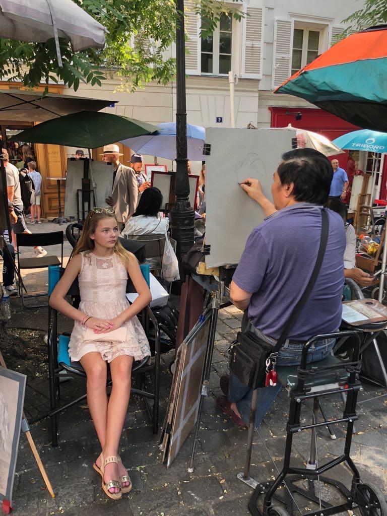 Having a sketch portrait done at Montmarte Paris Place du Tertre.jpg