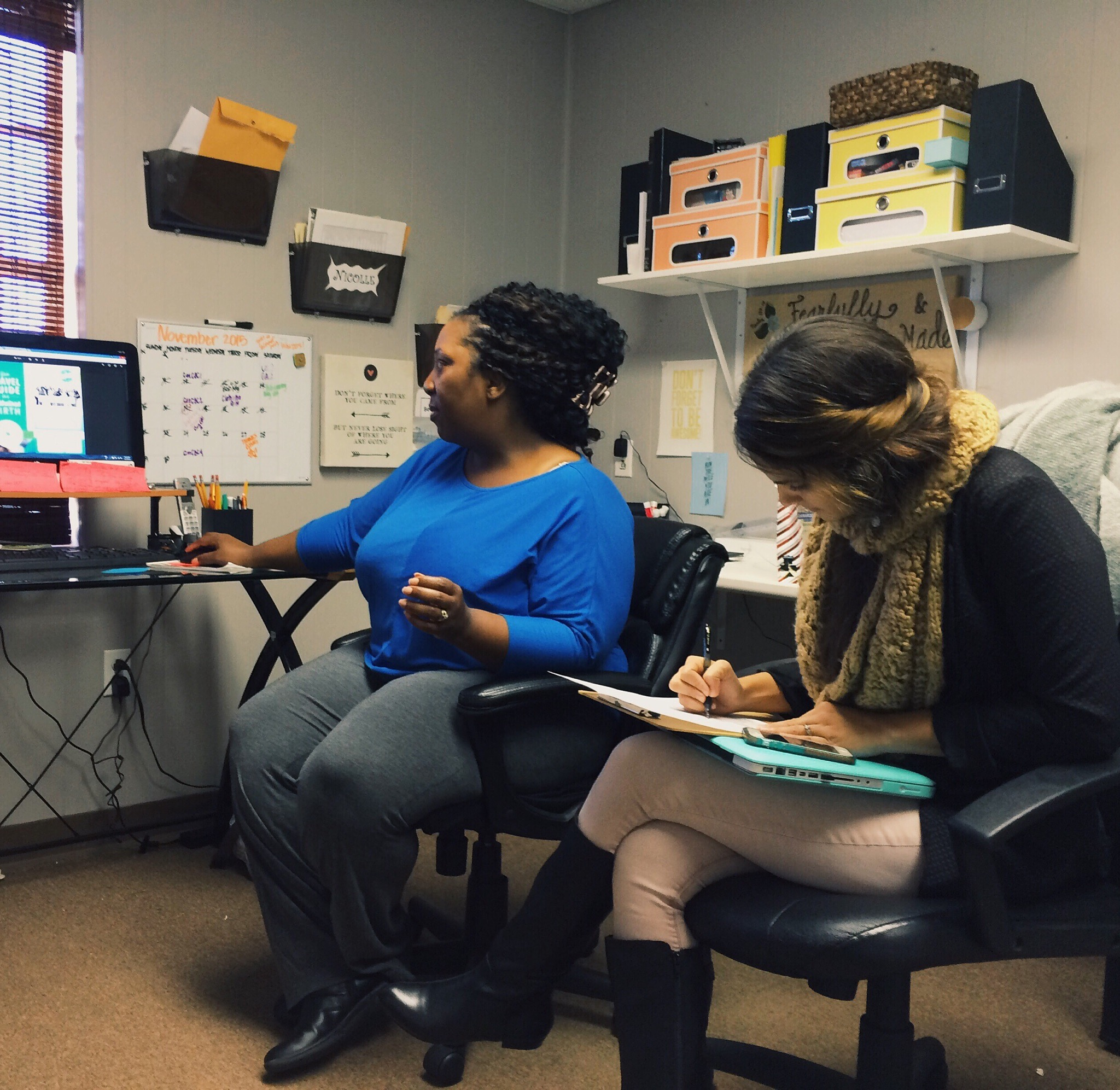 Nicolle and I in the zone, designing her new welcome packets for Birth by Design.
