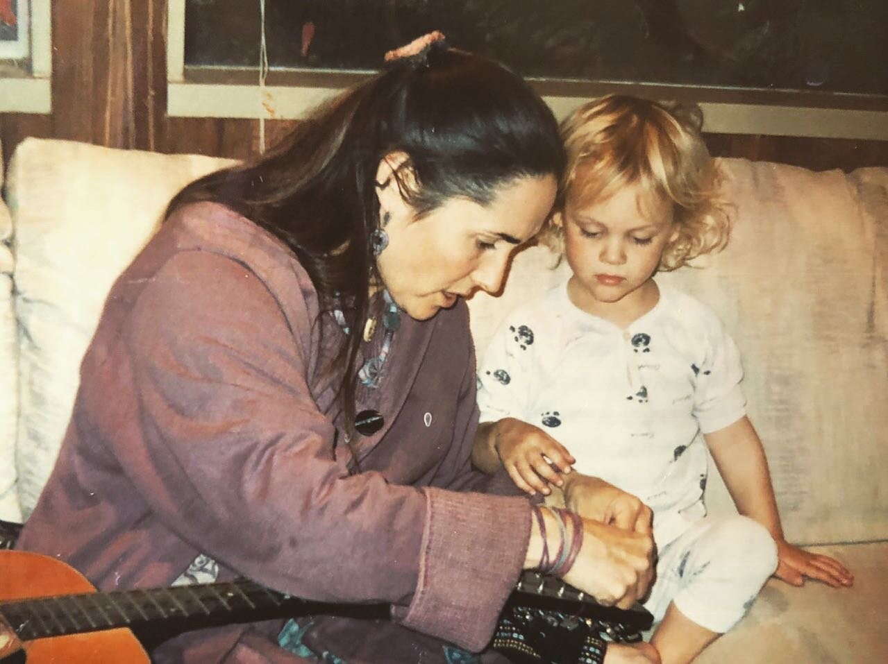 Mama teaching me how to restring my first guitar 💜 I don&rsquo;t know how I never saw this photo until now...