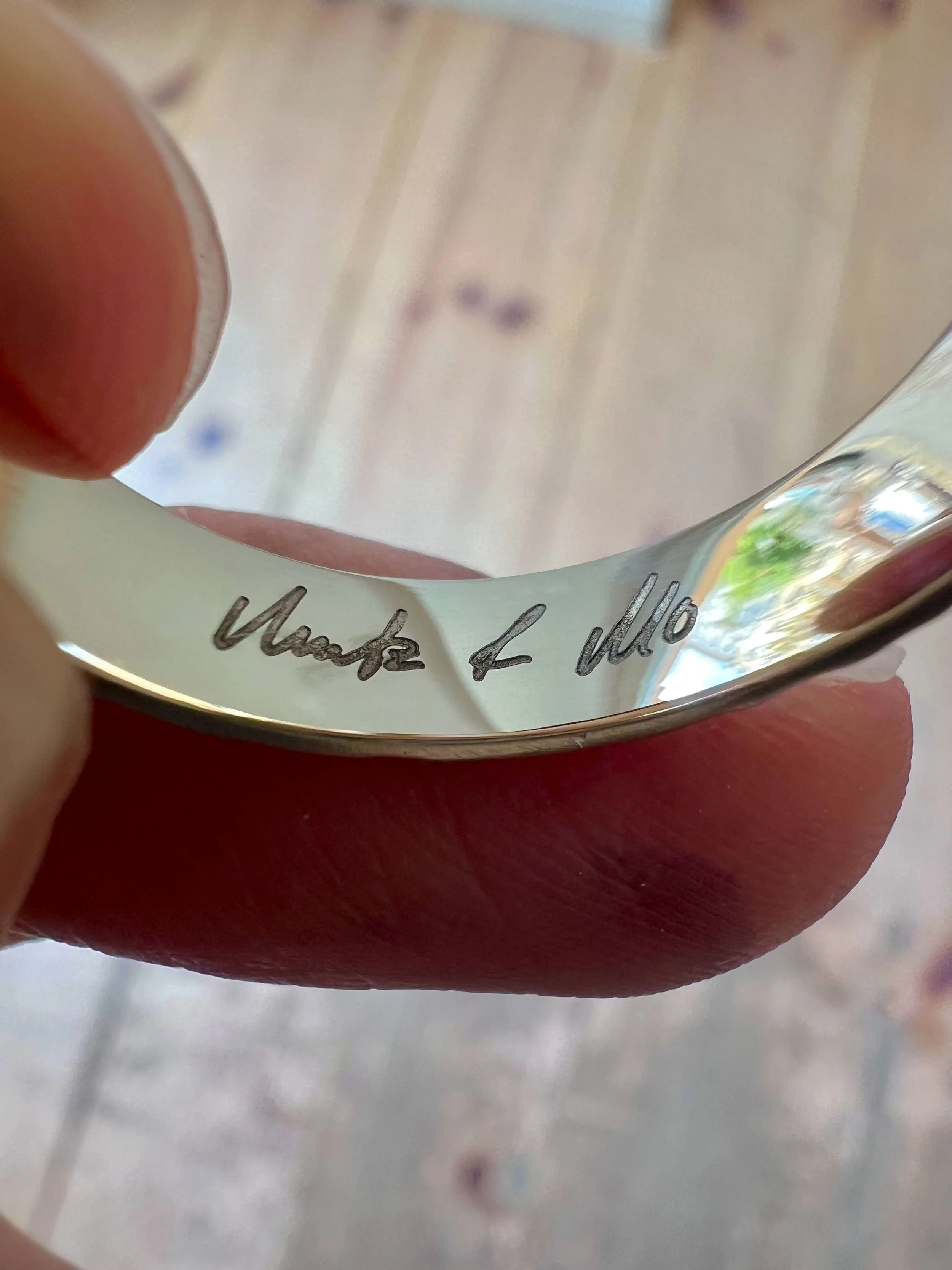Rings laser engraved with the handwriting of the the bride and groom