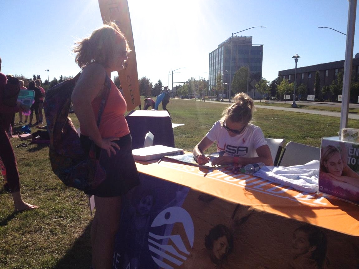 Poster signing at Yoga in the Park. 