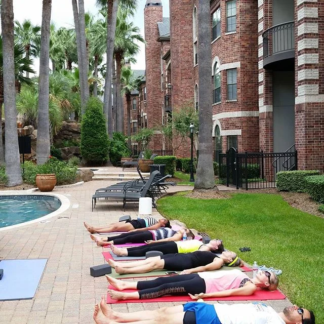 Michael led a yoga session for a group of residents of a Galleria-area apartment complex. While it was a hot and sweaty time, everyone enjoyed it.