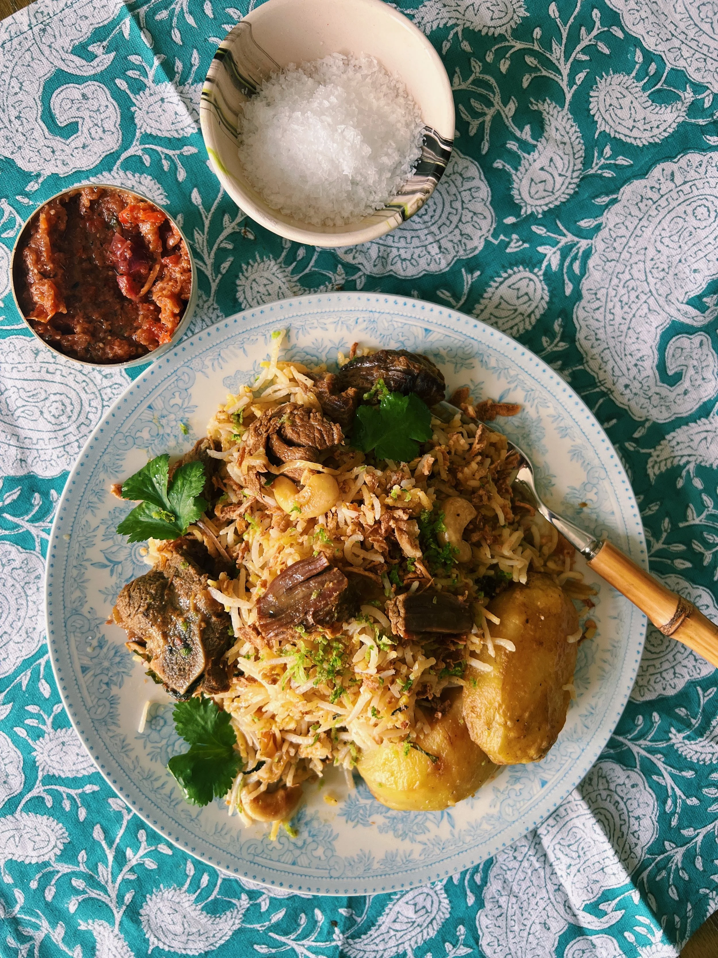Kacchi Mutton Biryani (Dhaka style mutton and rice layers) — golden tiffin