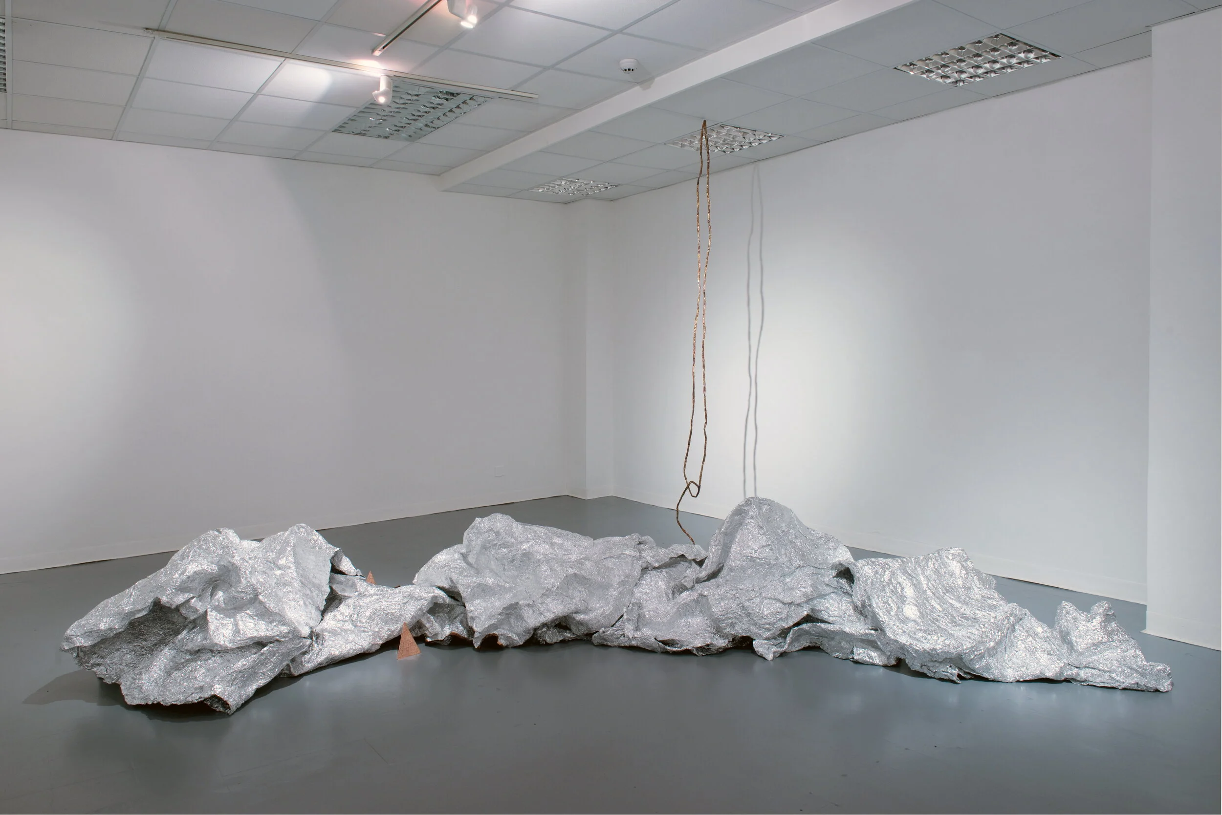 OPEN CIRCLE (foreground) Aluminium tape, copper tape, cardboard, plastic  Dimensions variable. Work in 19 parts. 2019 Image: Colin Davison