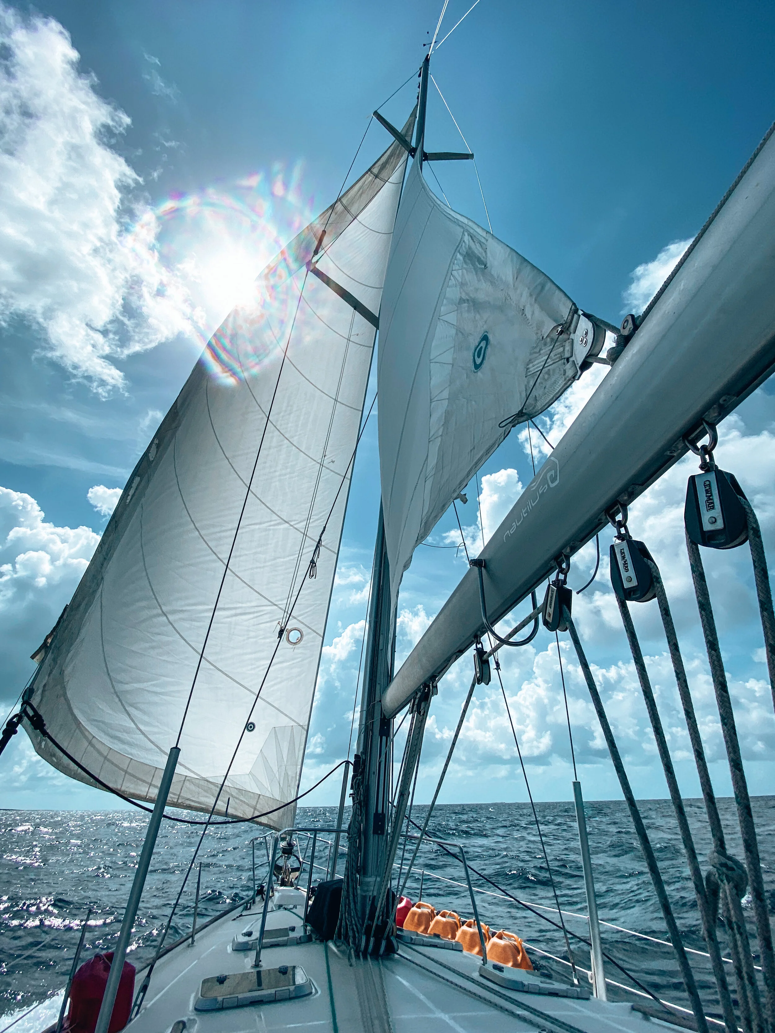  Sails up on Boom Sharkalaka in the middle of the ocean in the Bahamas. 