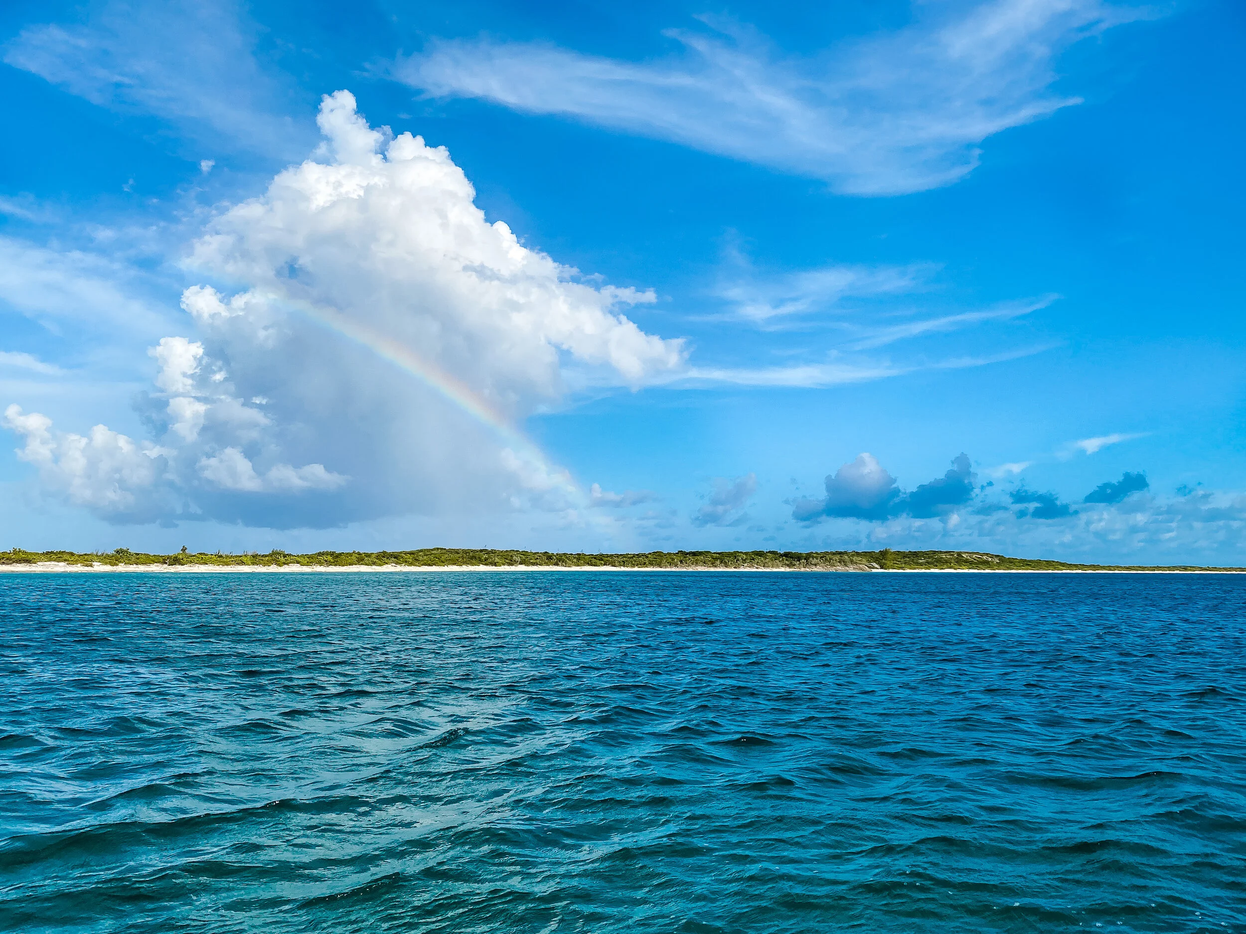  Colourful rainbow over an island in the Bahamas.  