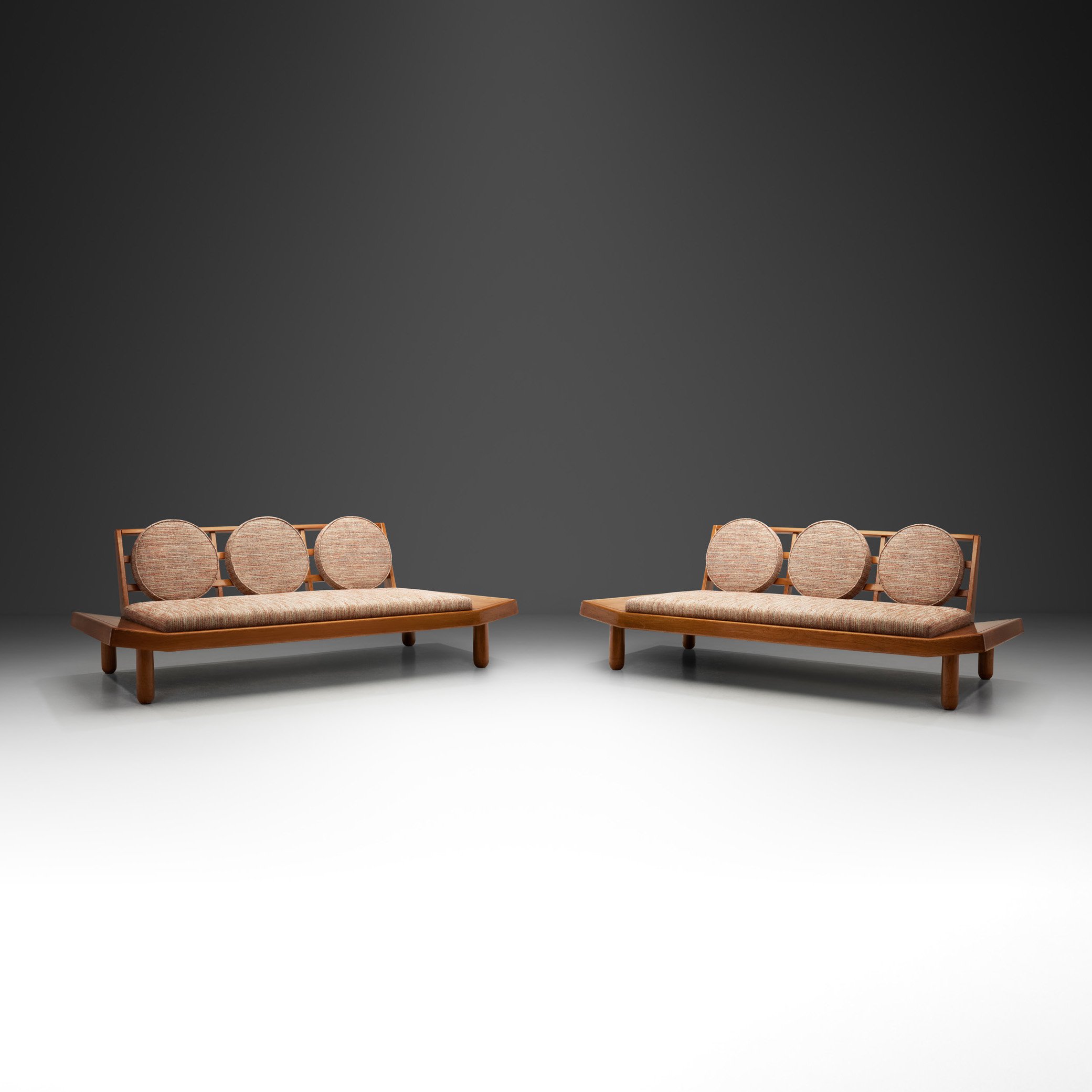 A Pair of Wooden Sofas with Round Cushions, Indonesia 1960s (sold)