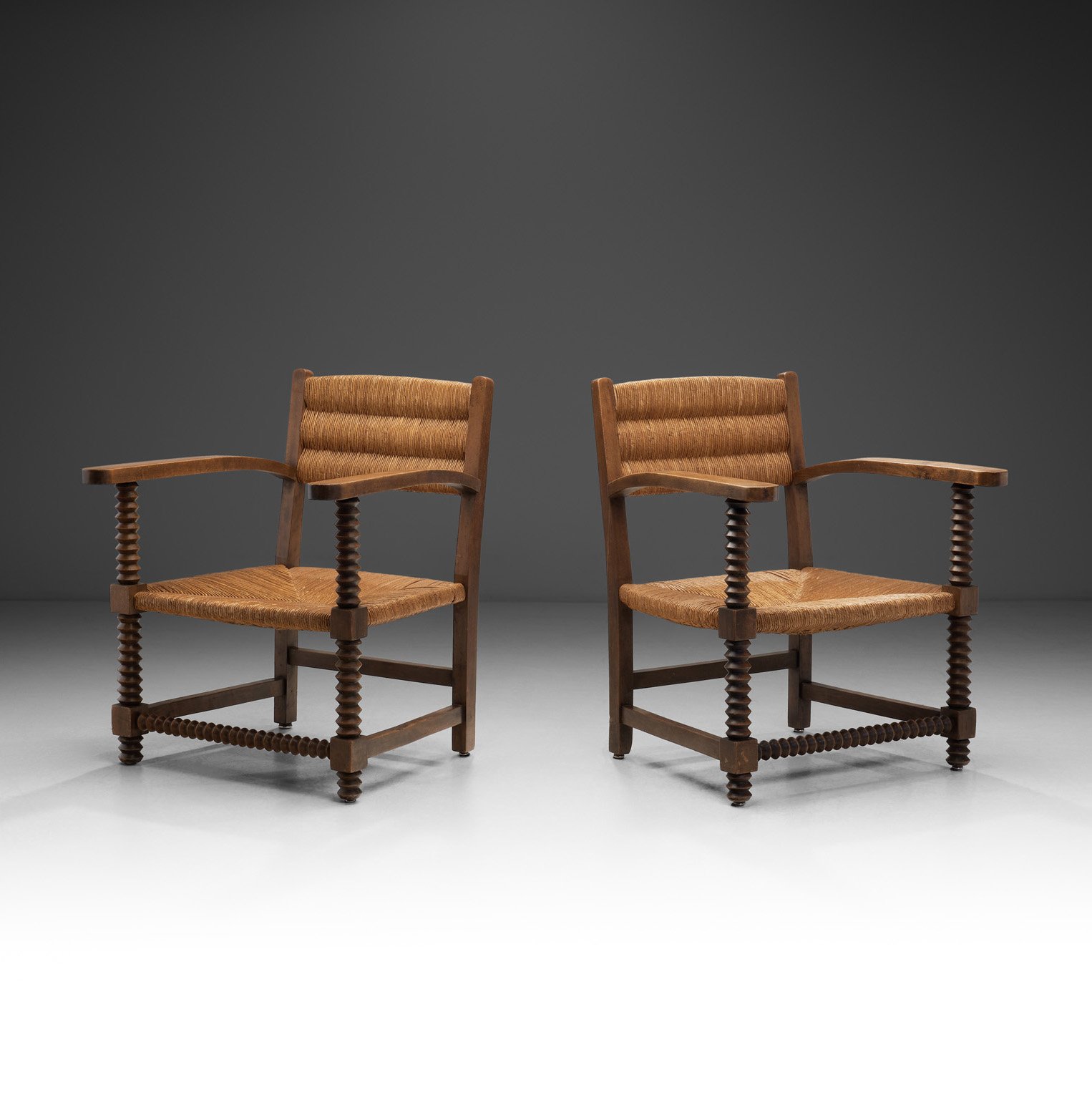 Pair of Oak and Woven Rush Chairs in the Manner of Charles Dudouyt, France 1940s (sold)