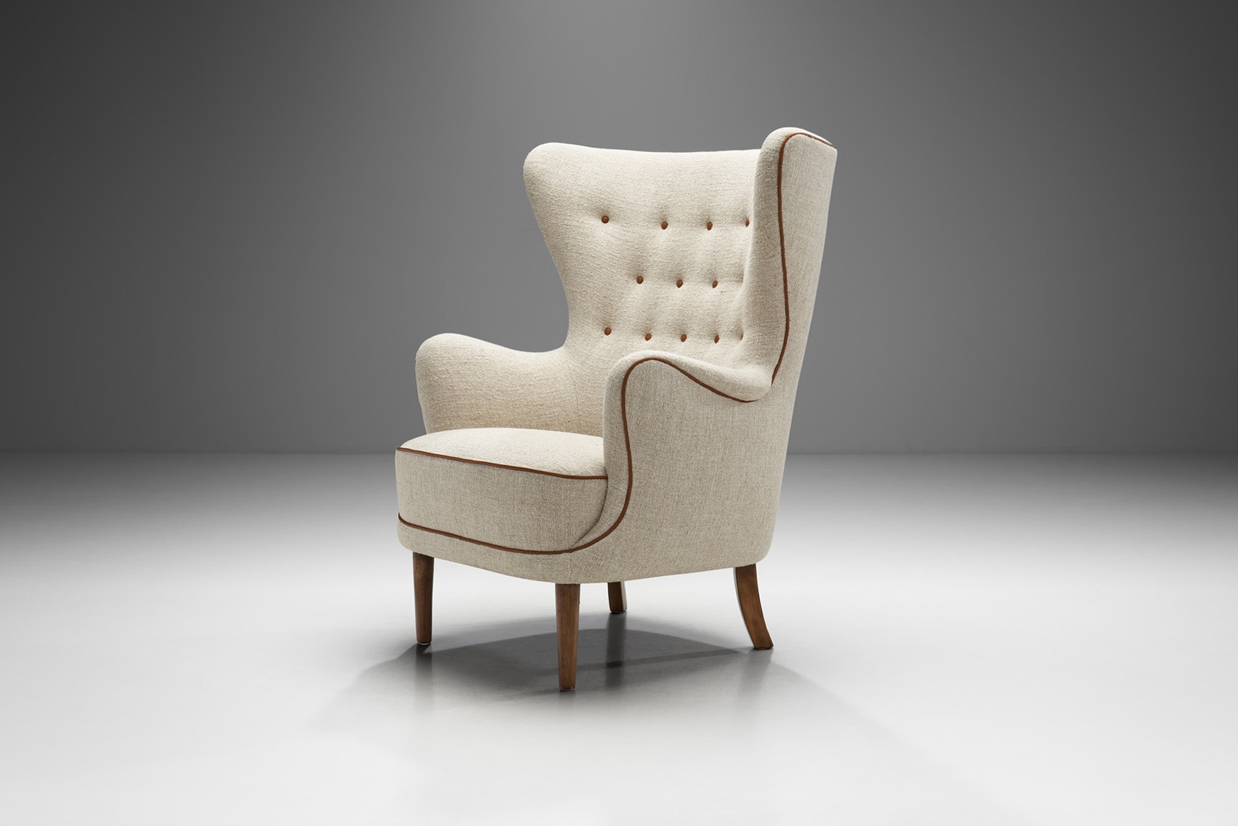 Danish Cabinetmaker Wing-Back Chair with Stained Beech Legs, Denmark ca 1950s (sold)
