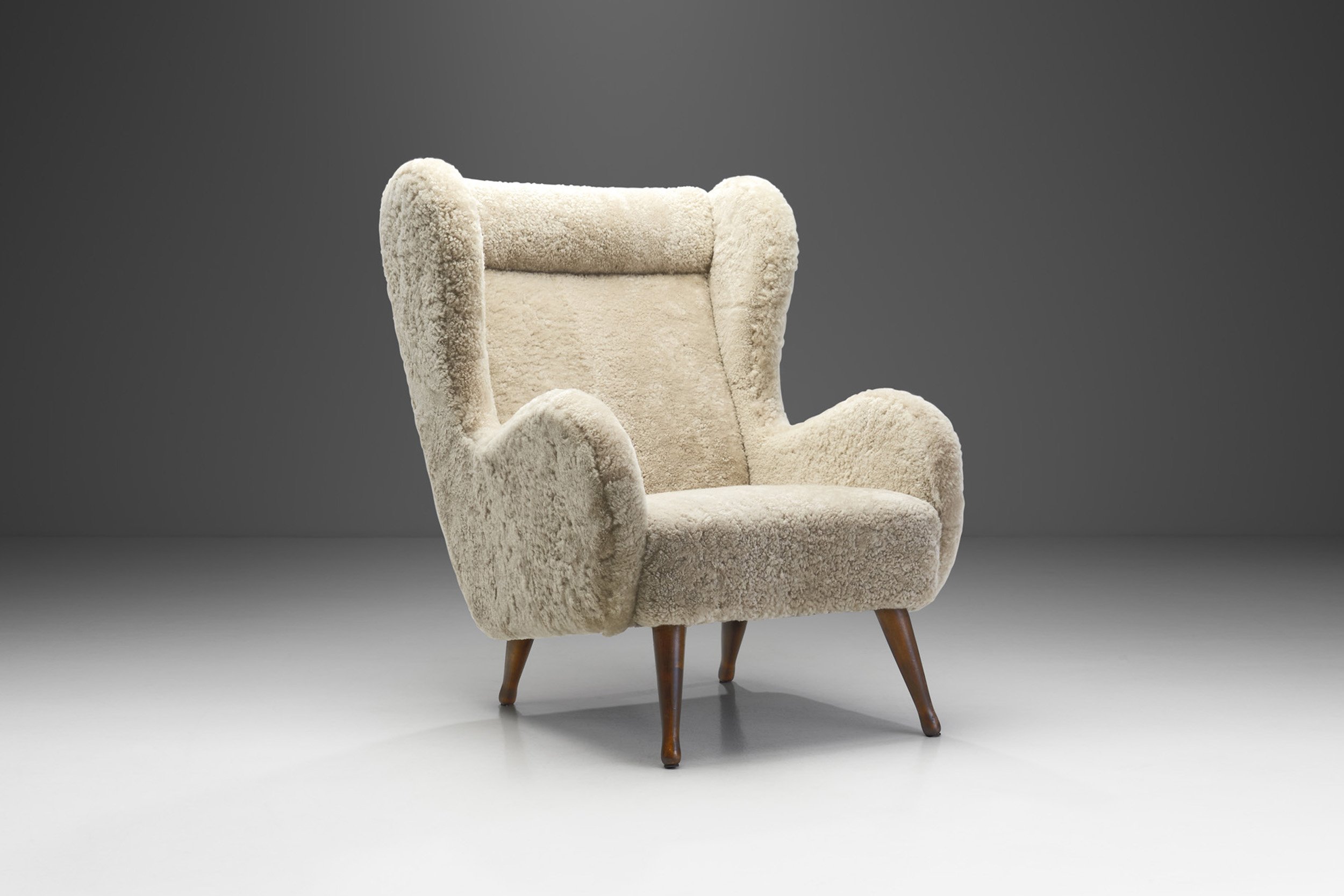 Swedish Cabinetmaker Winged Armchair in Sheepskin, Sweden ca 1940s (sold)