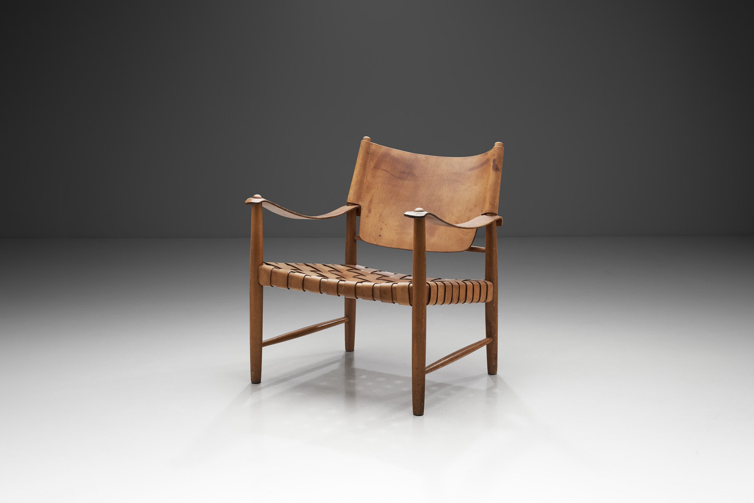 Danish Patinated Leather Safari Chair, Denmark ca 1960s (sold)