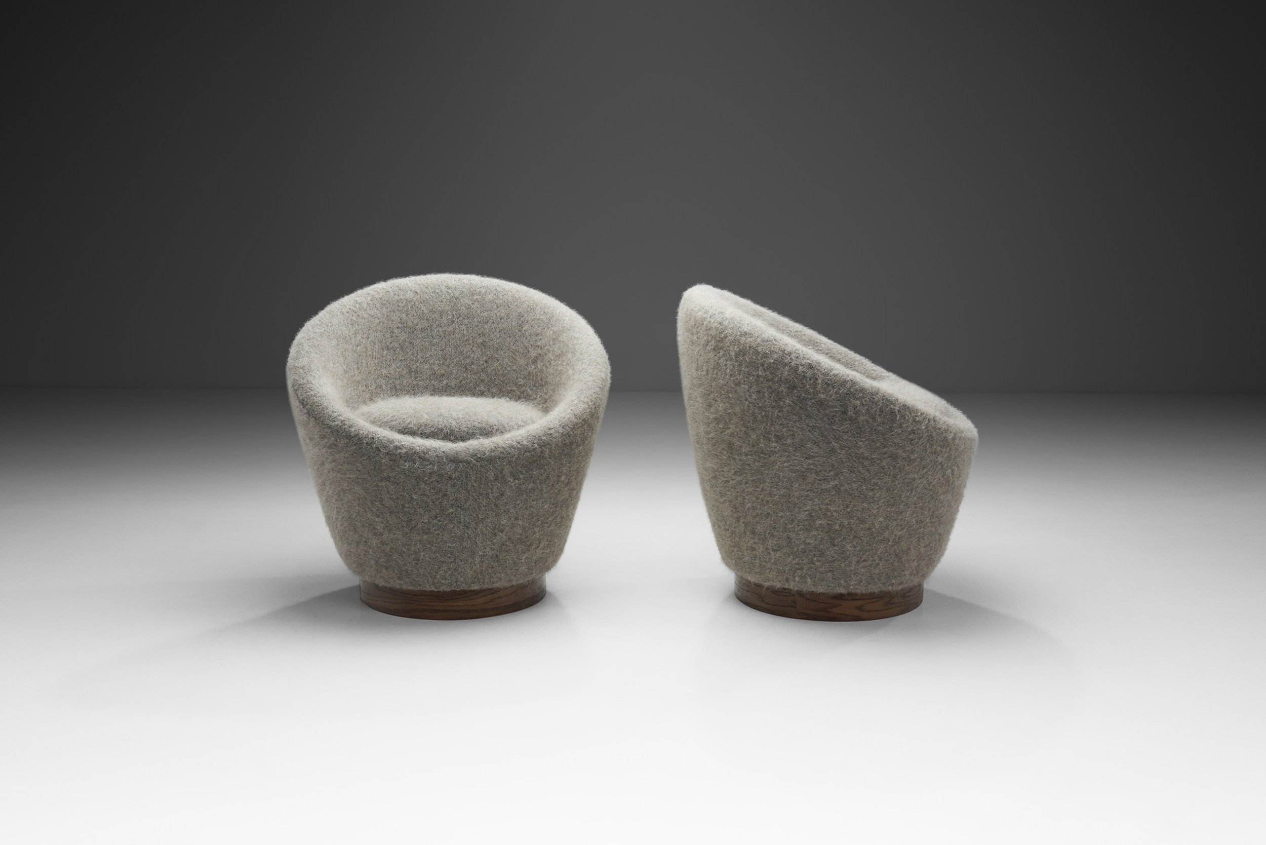 Upholstered Barrel Occasional Chairs with Wood Bases, Europe ca 1950s (sold)