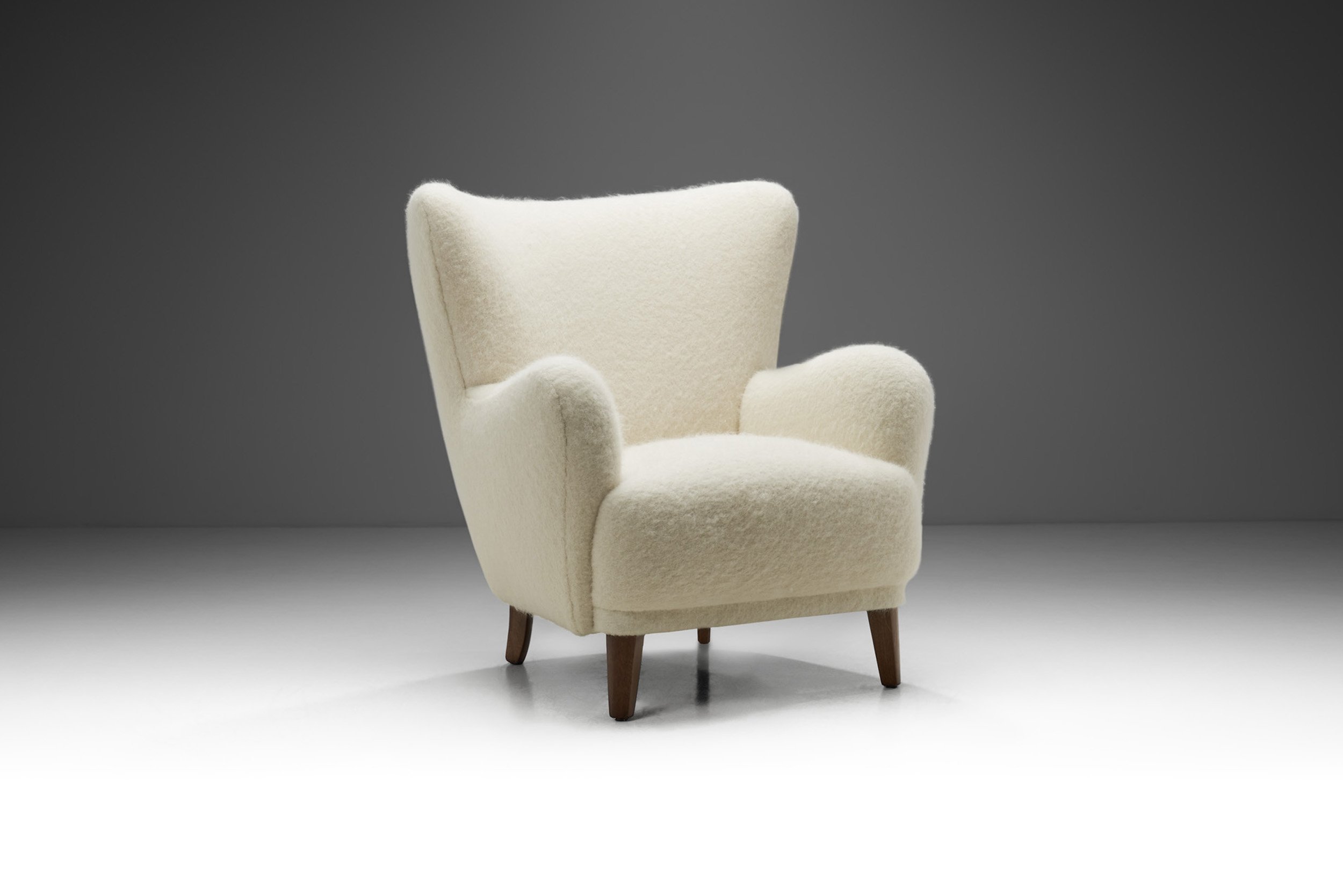 Danish Cabinetmaker Wingback Chair with Stained Wood Legs, Denmark ca 1950s (sold)