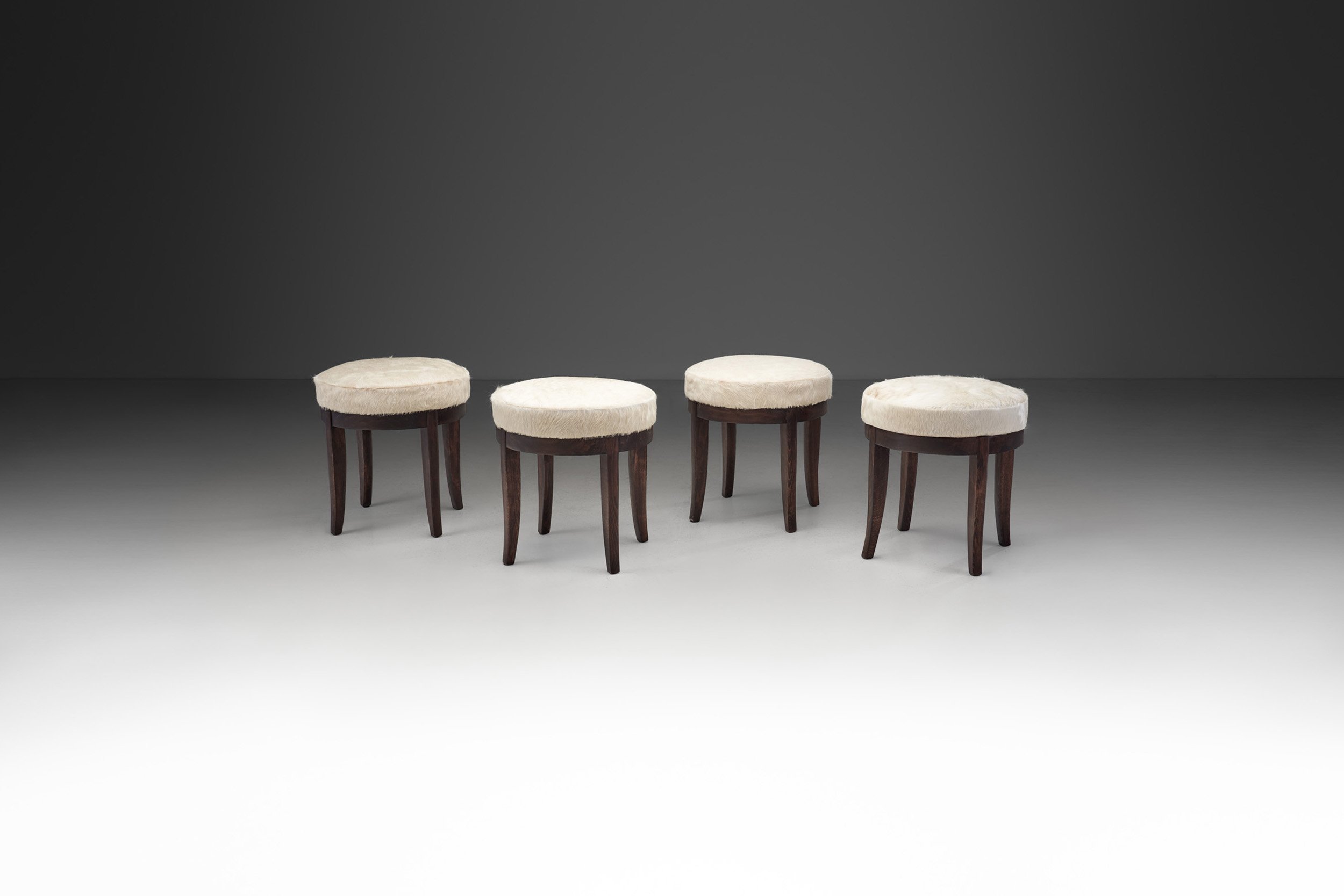 Mid-Century Modern Set of Four Stools  in Cowhide, Europe ca 1950s (sold)