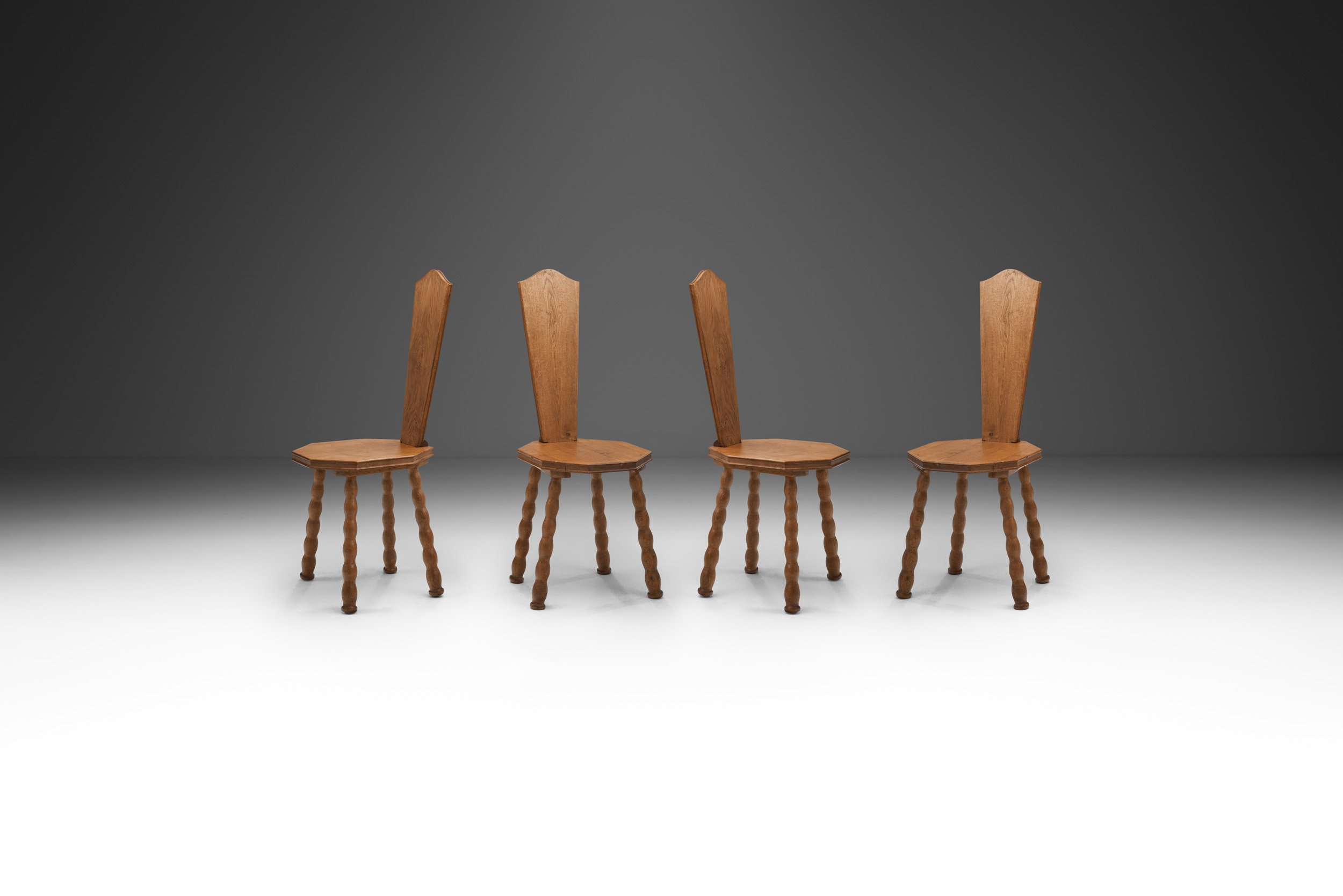 Set of 4 Sculptural Patinated Oak Spinning Chairs, Europe ca early 20th century (sold)
