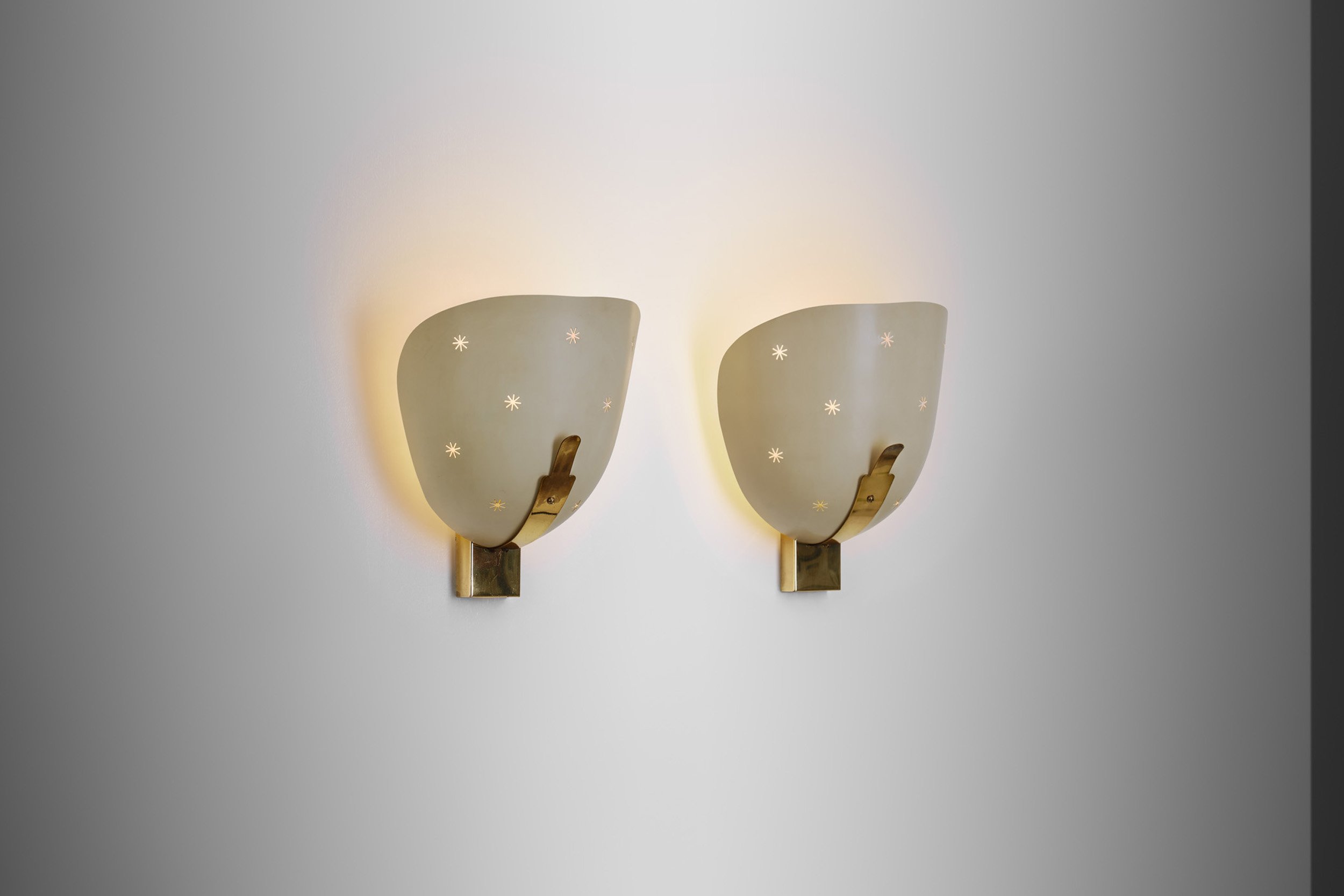 A Pair of Perforated Brass and Metal Wall Sconces, Europe 1950s (sold)