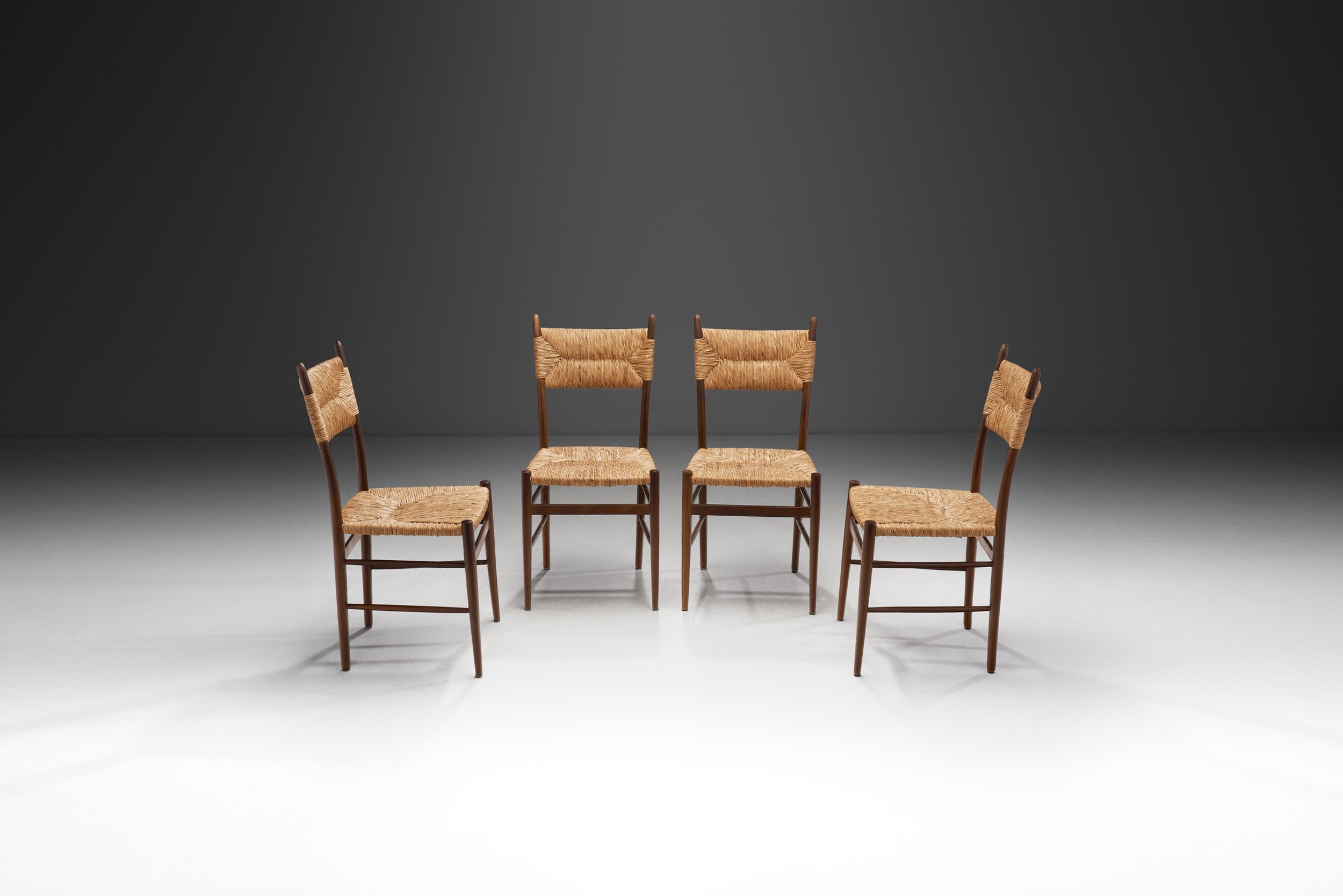 A Set of Four Dining Chairs with Woven Straw Seats and Backs, Europe ca 1950s (sold)