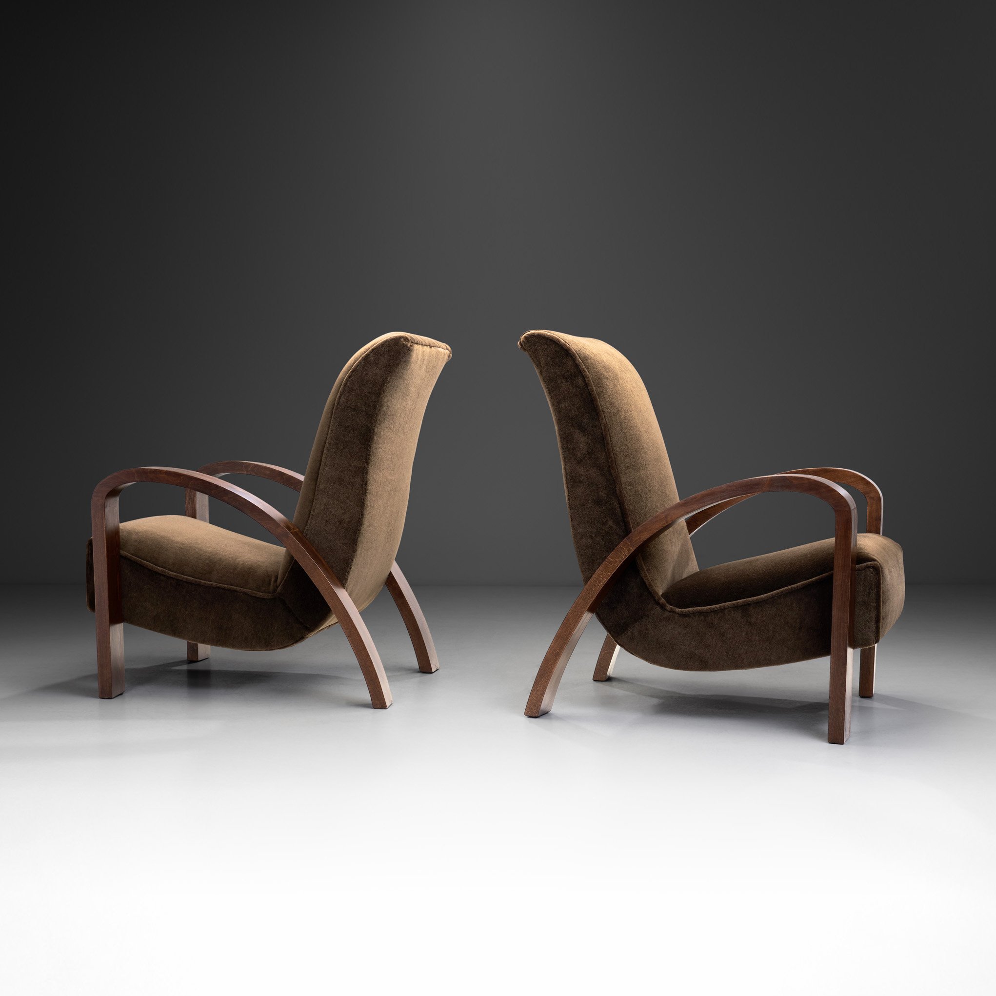 Pair of Upholstered Art Deco Armchairs with Curved Armrests, France 1930s (sold)