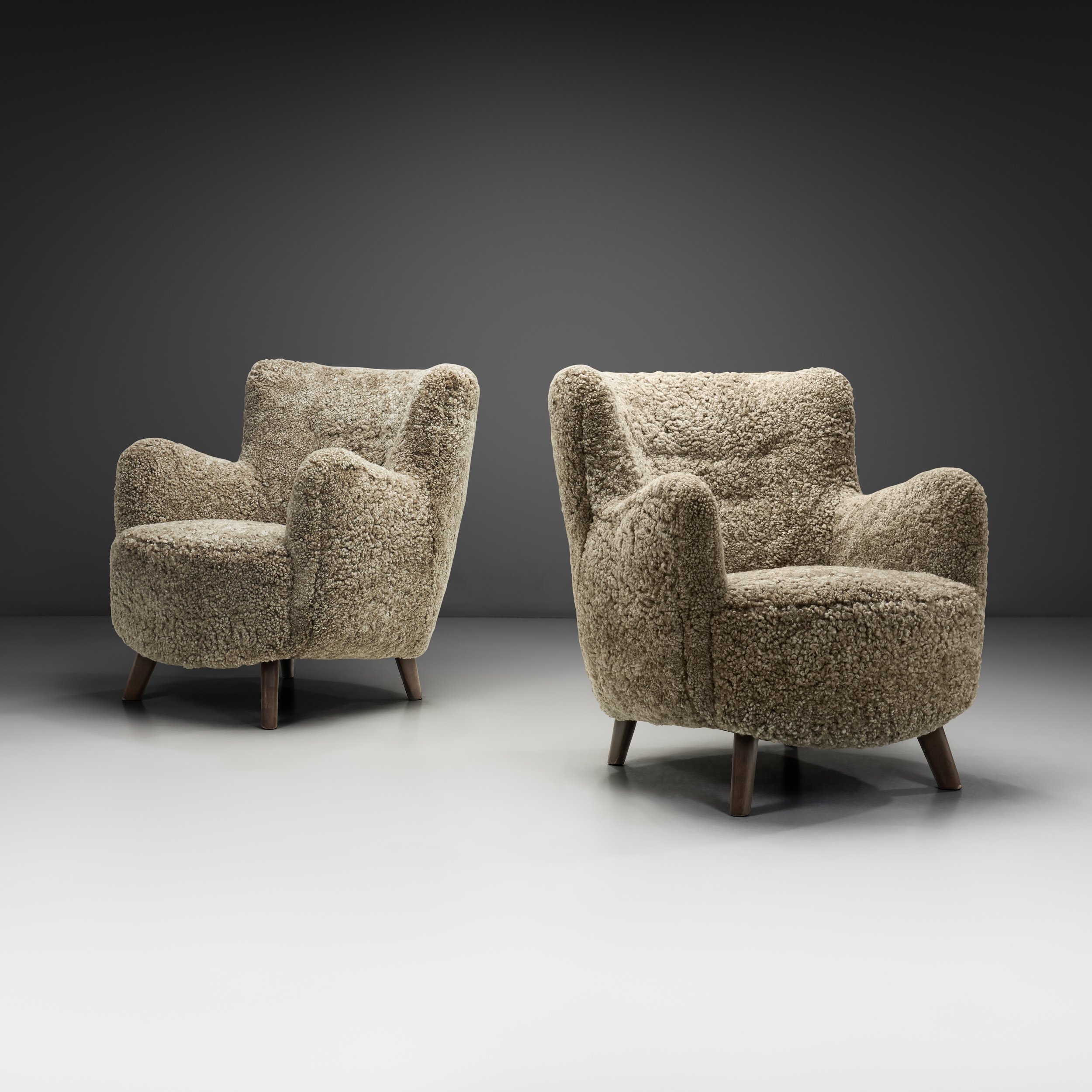 Pair of Mid-Century Lounge Chairs in Sheepskin, Europe Mid-20th Century (sold)