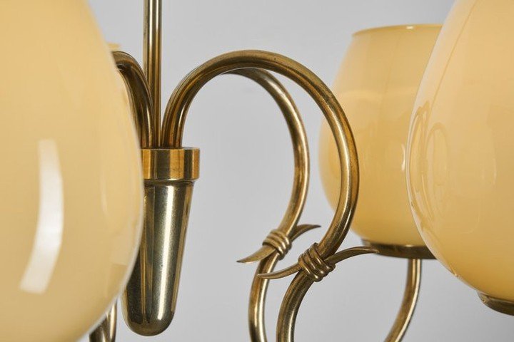 Gunnel Nyman helped shape the uniquely Finnish approach to lighting that emerged in the mid-20th century, where the purpose of a lamp was not only to shine, but to dictate atmosphere. Even decades later, this chandelier resonates with a modern interi