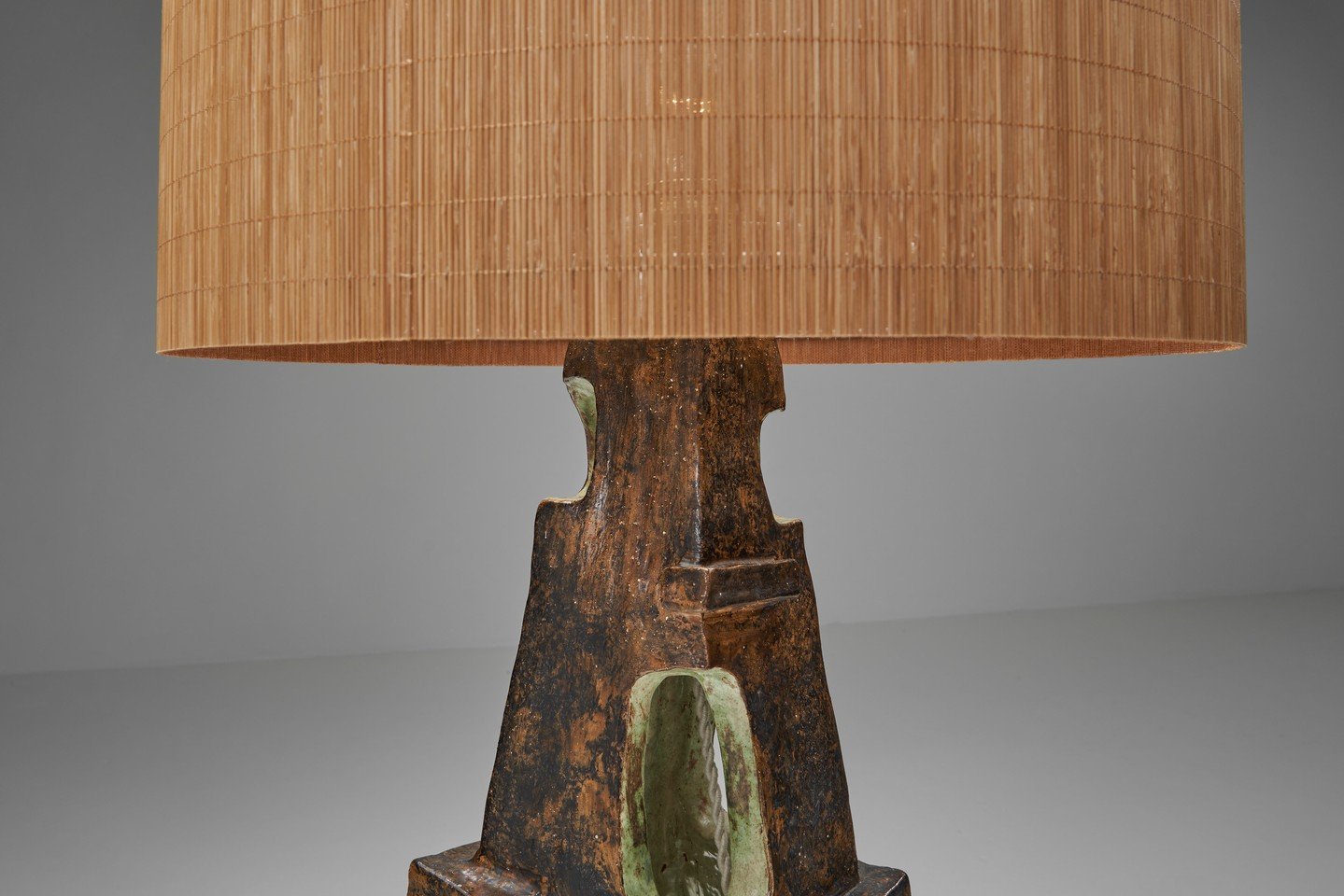 This striking 1960s table lamp reflects Europe&rsquo;s interest in organic abstraction, tactile materials, and honest craftsmanship. Both artistic and functional, it works as a sculptural object as much as a light source.⁠
⁠
The ceramic base features