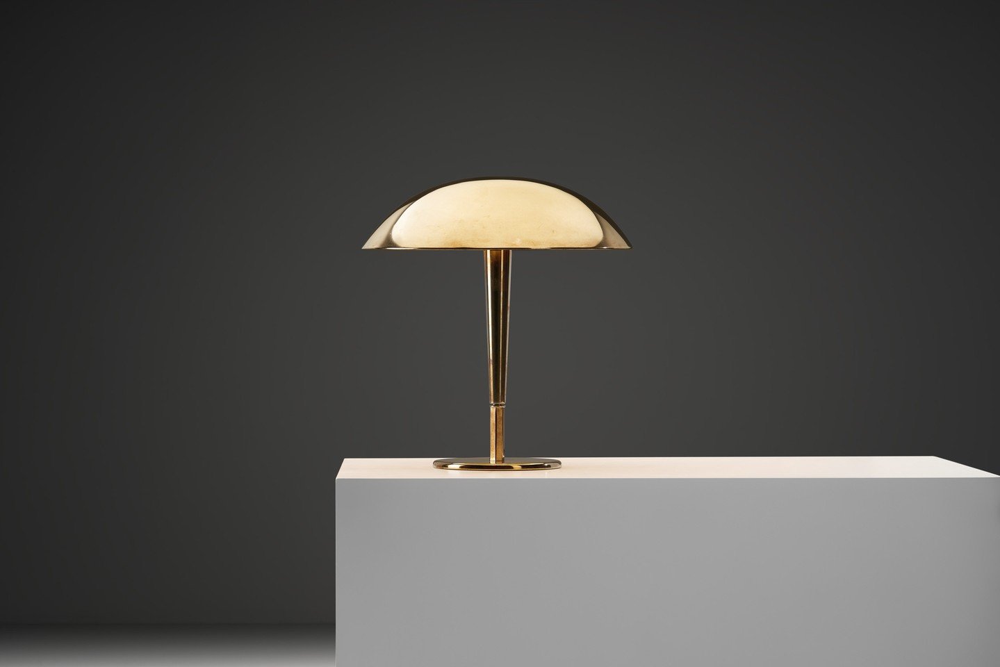 The model "5061" table lamp reveals how well Paavo Tynell understood the relationship between material and illumination. Every line is intentional, lending the piece a calm, confident presence. ⁠
⁠
The gently domed shade flows outward in a 