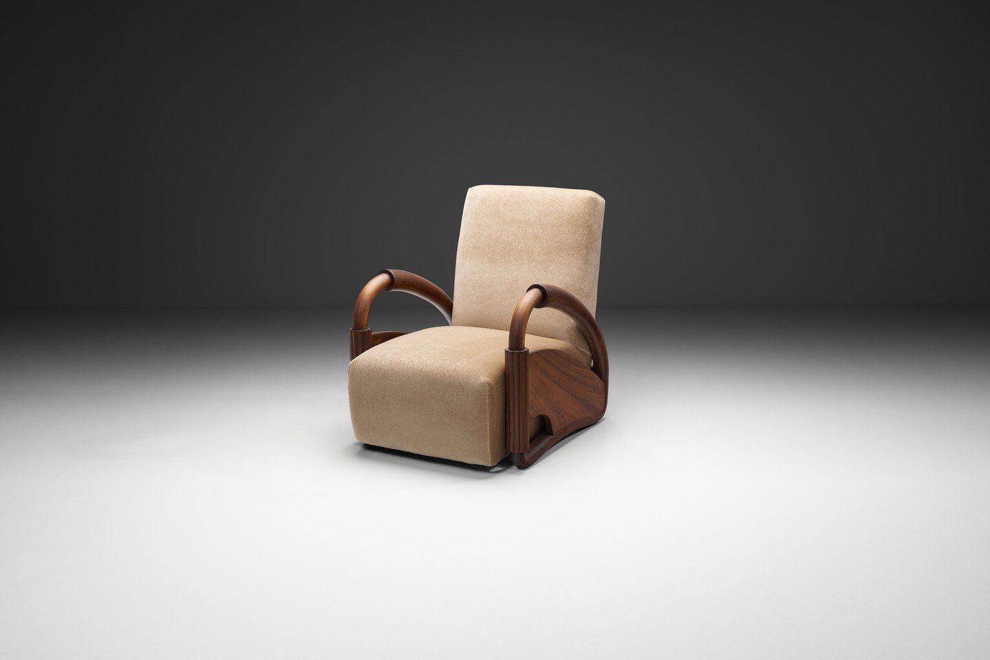 Crafted in the manner of Andr&eacute; Arbus - one of the most influential Art Deco designers in the first half of the twentieth century - this chair reflects a thoughtful approach to form and material. The solid wood frame is shaped through gentle cu