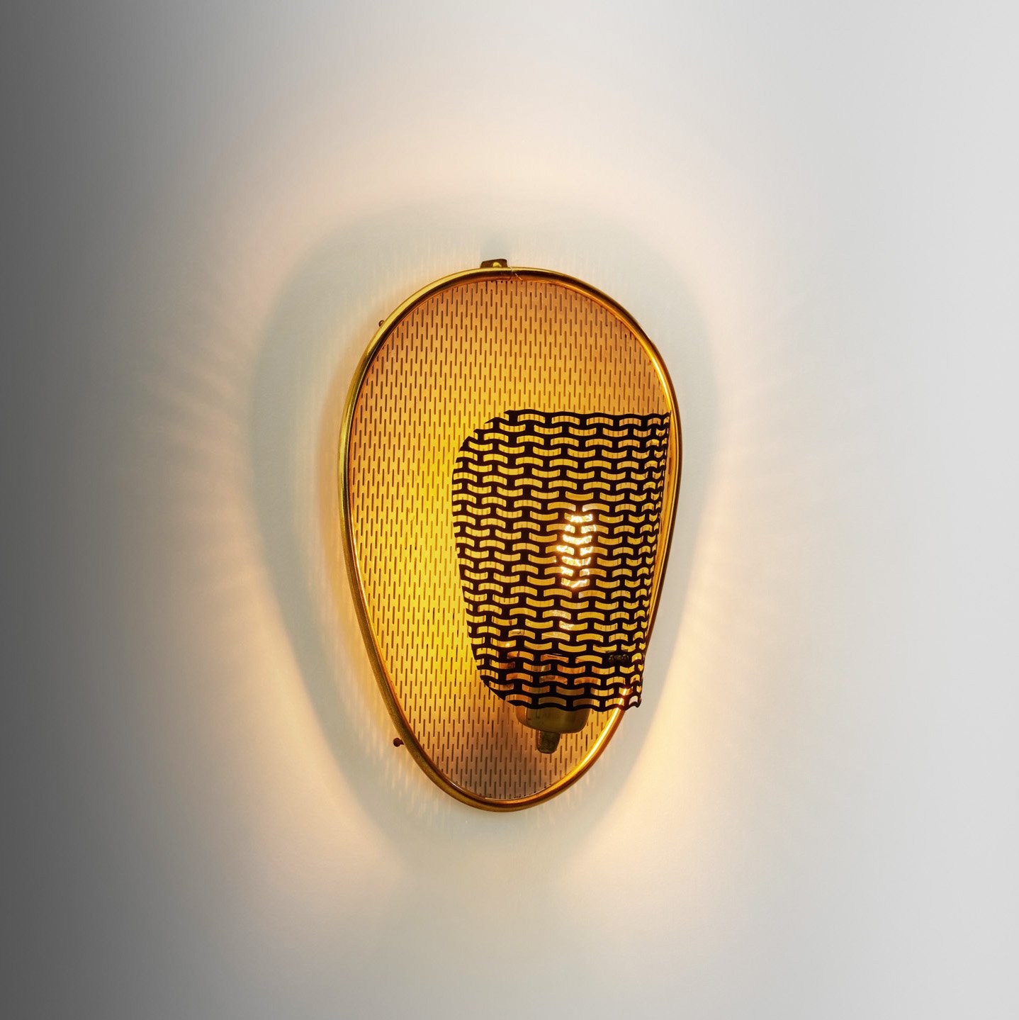 Perforated Brass Wall Lamp with Lacquered Metal Backplate, Europe Mid-20th Century
