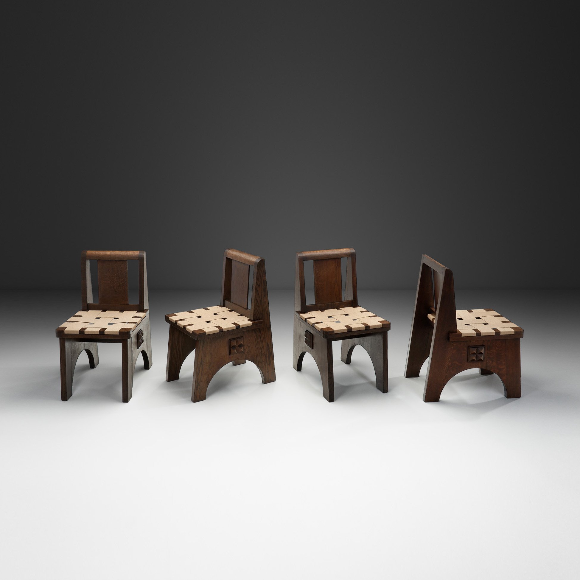 Set of Four Stained Oak Chairs in the manner of Charles Dudouyt, France 20th Century