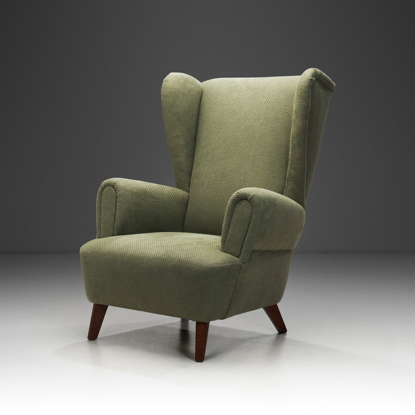 Wingback Armchair Upholstered in Dark Green, Europe Mid-20th Century