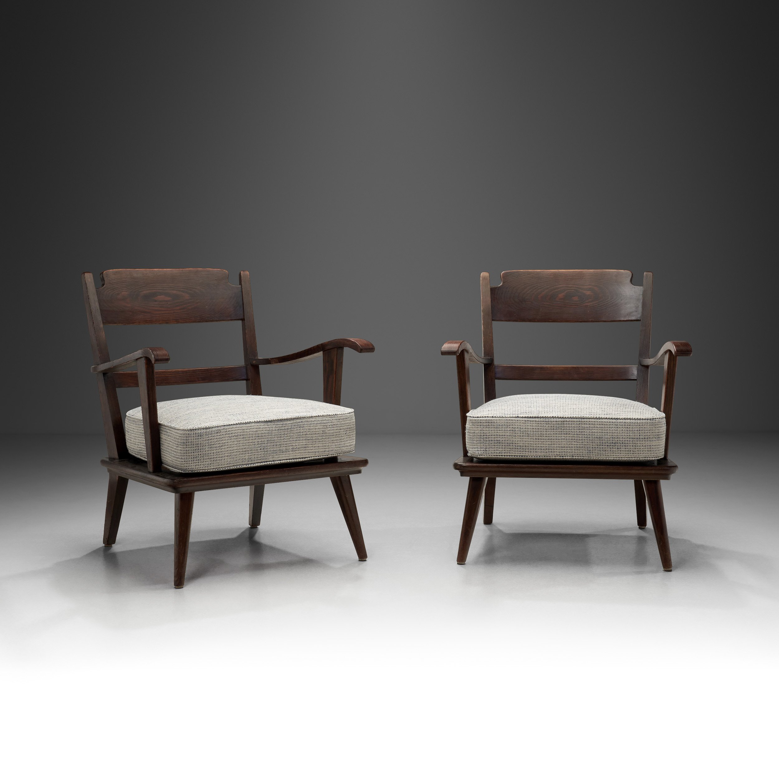 Pair of Dark Stained Pine Armchairs, Europe First half of the 20th century