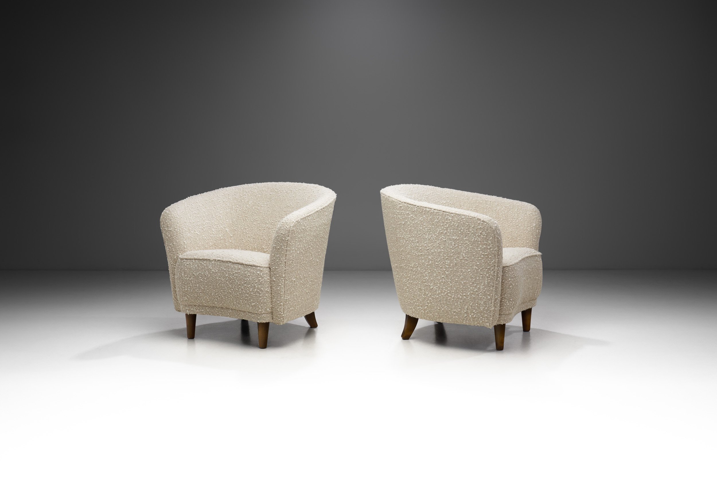 Pair of Enveloping Cabinetmaker Armchairs in Bouclé, Europe Mid-20th century (sold)