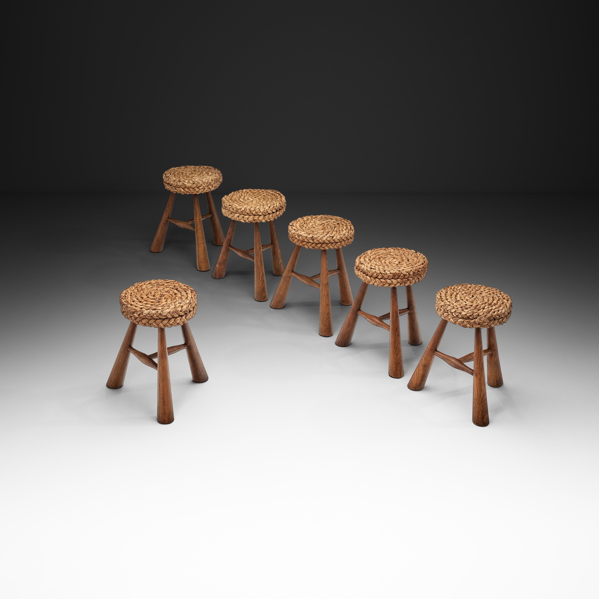 Six Mid-Century Stools with Woven Seats in the manner of Adoux-Minet, France 1950s
