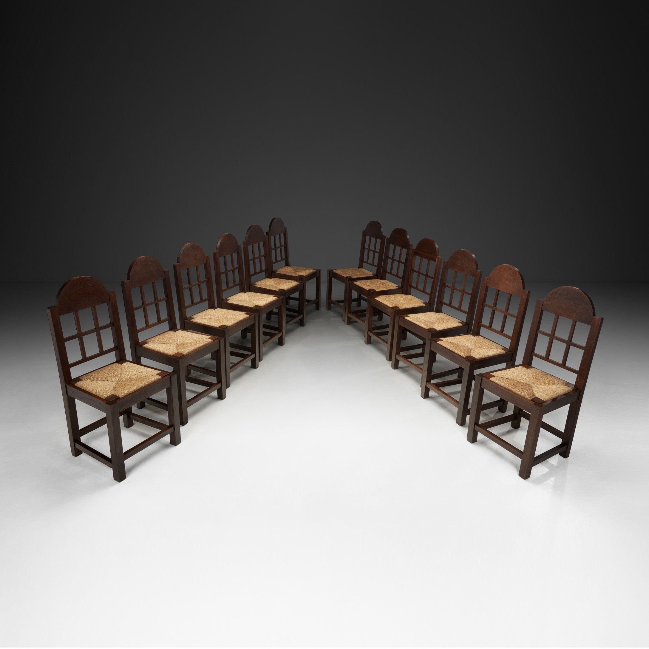 Set of Twelve Oak and Straw Dining Chairs with Gendarme Backs, Spain ca 1930s