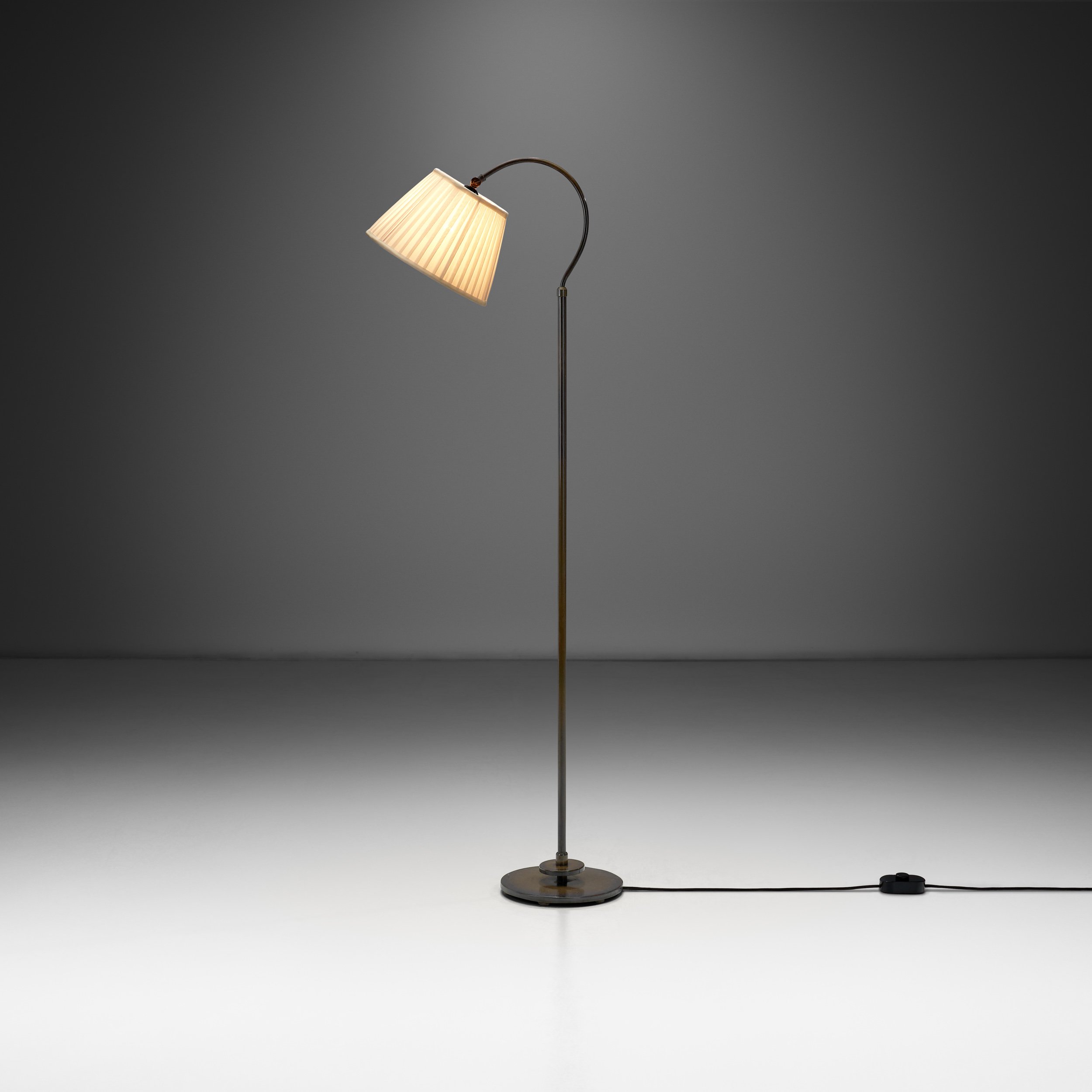 Patinated Brass Floor Lamp with Curved Neck, Europe first half of the 20th century