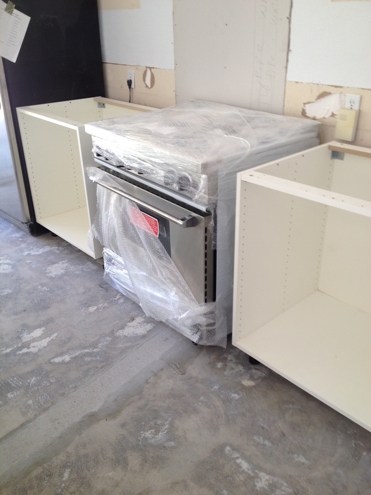 Blue Star range positioned into place