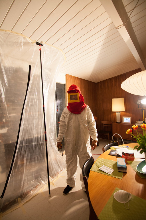 Fireplace ZipWalled and John suited up for blasting. 