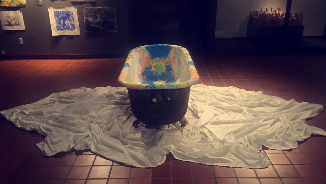   Porcelain's Past      My intension with using this ready-made is to repurpose it and communicate the idea of the many colorful layers representing time. This bathtub has been in my family for three generations and has been sitting outside upside do