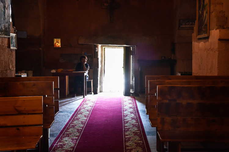 The caretaker at her desk inside the church