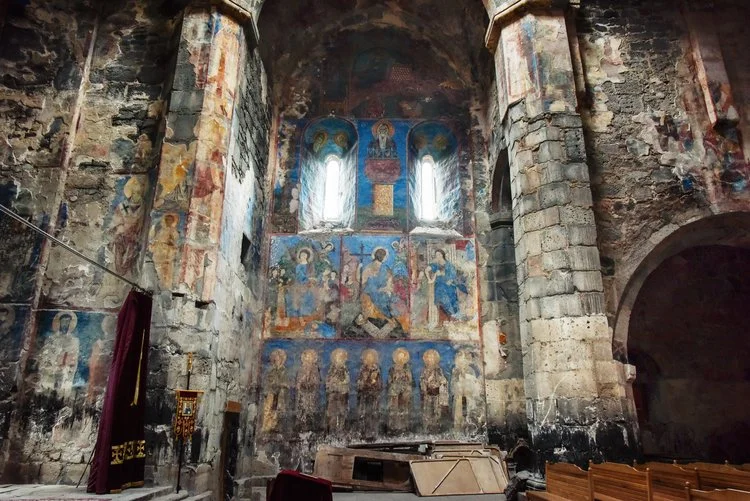 Unrestored frescoes in the sanctuary
