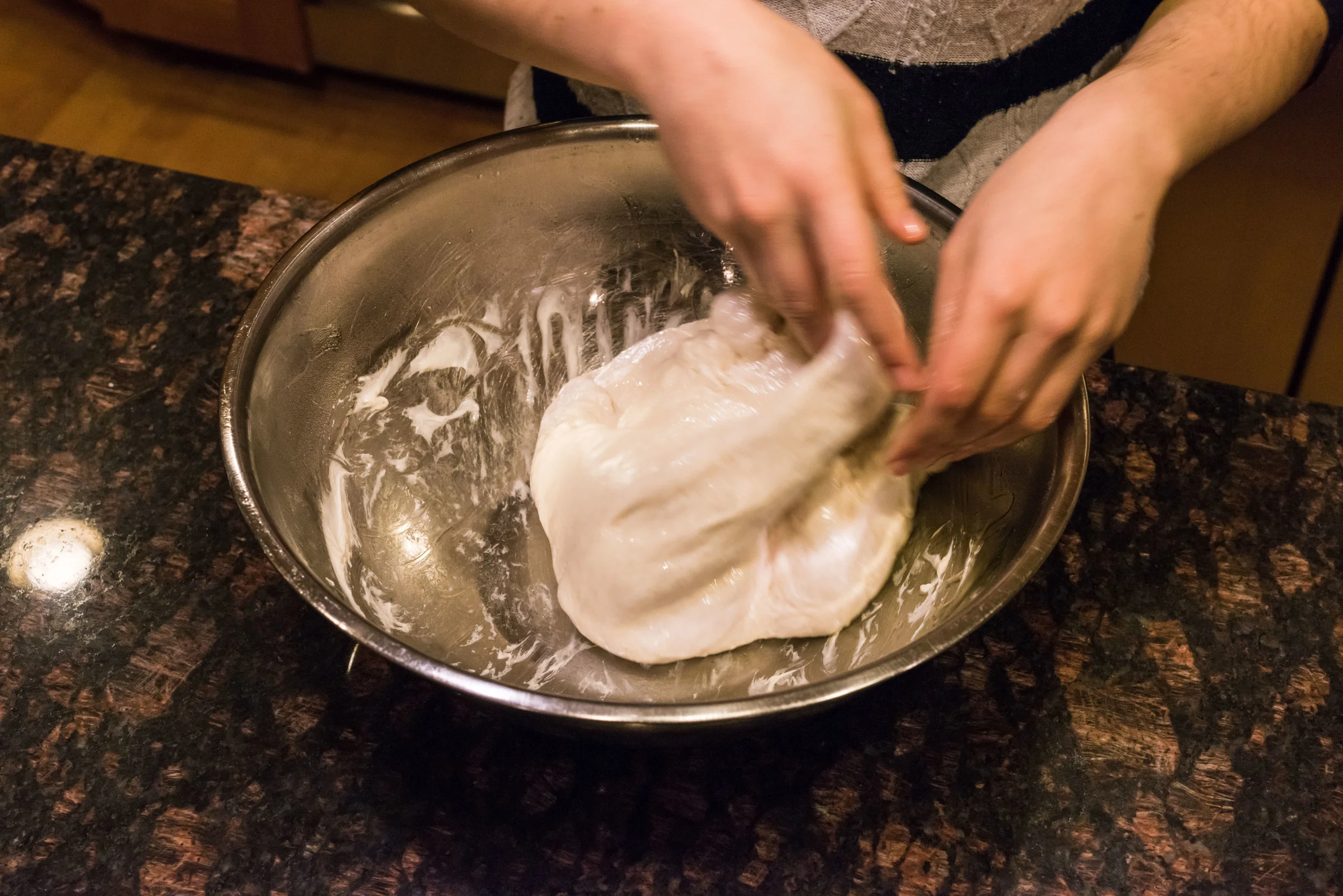 Punch down the dough and knead it briefly before the second rise