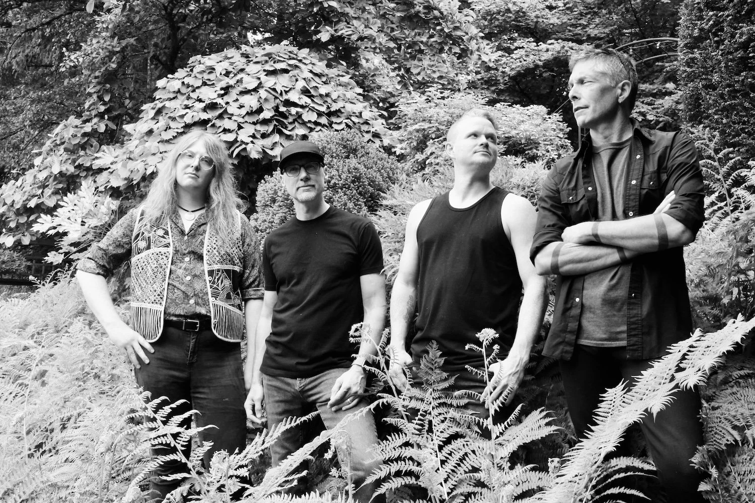 Ryker & The Rise band standing in a forest of ferns