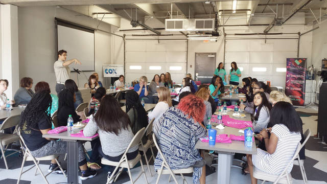 Girls learning about careers and local tech companies at Women in Tech event at StarSpace46